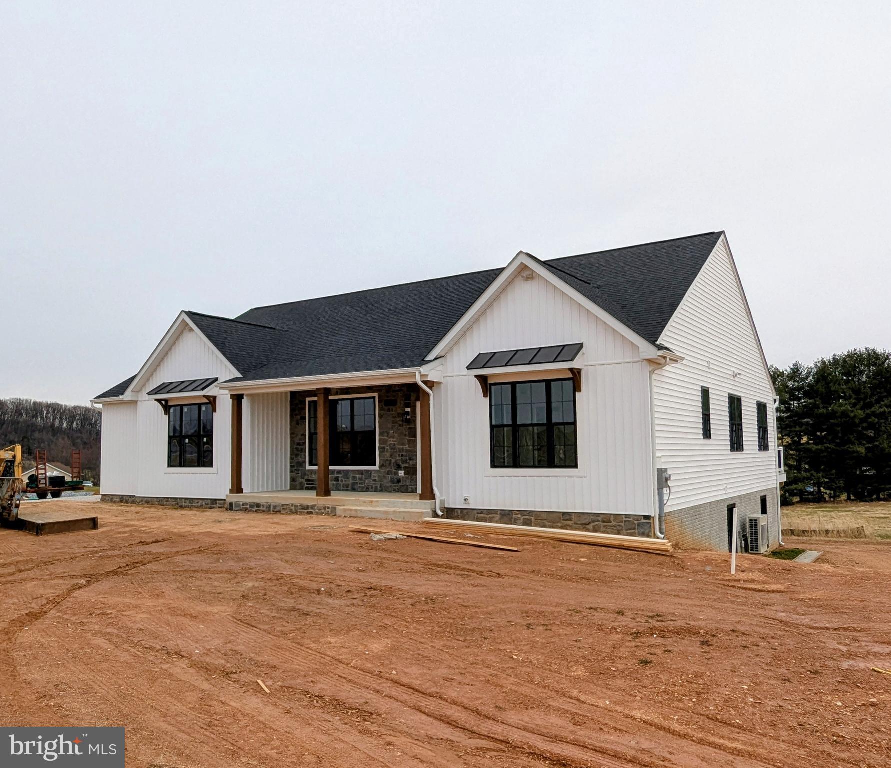 Welcome to your dream home! This stunning new construction rancher is nestled on over 3 acres of pristine land, offering the perfect blend of luxury and tranquility. As you approach the home, you’ll be greeted by the charming covered front porch that not only adds curb appeal but also presents views of the majestic mountains and the rolling pastures of Frederick County—perfect for sipping your morning coffee or unwinding in the evening.
Step inside to discover the spacious great room with its open-concept living design, ideal for entertaining or enjoying quality family time. The impressive cathedral ceilings create an airy atmosphere, enhancing the sense of space while allowing natural light to flood the room. Adjoining the great room is a contemporary kitchen equipped with top-of-the-line appliances and ample counter space, and a center island, making it a chef’s delight.
Retreat to the large owner's suite, your personal sanctuary featuring generous dimensions and lavish finishes. This serene space is designed for relaxation, with a beautifully appointed ensuite that promises a spa-like experience every day.
But that's not all—this rancher's finished lower level offers additional living space that can be tailored to your needs, whether it’s a game room, home theater, gym, or guest quarters. The versatility of this area makes it perfect for any lifestyle.
Step outside onto the expansive deck that extends your living space into the great outdoors. The sprawling backyard is a blank canvas, ready for you to create your own private oasis—whether it’s gardening, hosting summer barbecues, or simply enjoying the peaceful surroundings.
This rancher is not just a home; it’s a lifestyle. Experience the perfect blend of modern comforts, stunning natural surroundings, and exceptional craftsmanship. Don’t miss the opportunity to make this beautiful property your own. Schedule a tour today and see for yourself the endless possibilities that await!