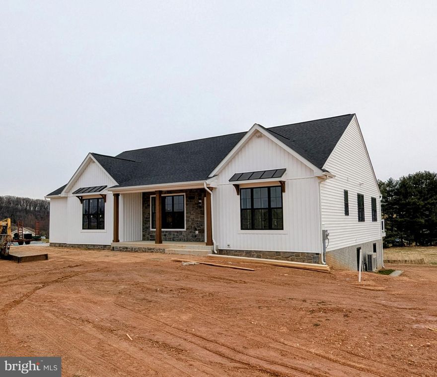 Welcome to your dream home! This stunning new construction rancher is nestled on over 3 acres of pristine land, offering the perfect blend of luxury and tranquility. As you approach the home, you’ll be greeted by the charming covered front porch that not only adds curb appeal but also presents views of the majestic mountains and the rolling pastures of Frederick County—perfect for sipping your morning coffee or unwinding in the evening.

Step inside to discover the spacious great room with its open-concept living design, ideal for entertaining or enjoying quality family time. The impressive cathedral ceilings create an airy atmosphere, enhancing the sense of space while allowing natural light to flood the room. Adjoining the great room is a contemporary kitchen equipped with top-of-the-line appliances and ample counter space, and a center island, making it a chef’s delight.

Retreat to the large owner's suite, your personal sanctuary featuring generous dimensions and lavish finishes. This serene space is designed for relaxation, with a beautifully appointed ensuite that promises a spa-like experience every day.

But that's not all—this rancher's finished lower level offers additional living space that can be tailored to your needs, whether it’s a game room, home theater, gym, or guest quarters. The versatility of this area makes it perfect for any lifestyle.

Step outside onto the expansive deck that extends your living space into the great outdoors. The sprawling backyard is a blank canvas, ready for you to create your own private oasis—whether it’s gardening, hosting summer barbecues, or simply enjoying the peaceful surroundings.

This rancher is not just a home; it’s a lifestyle. Experience the perfect blend of modern comforts, stunning natural surroundings, and exceptional craftsmanship. Don’t miss the opportunity to make this beautiful property your own. Schedule a tour today and see for yourself the endless possibilities that await!