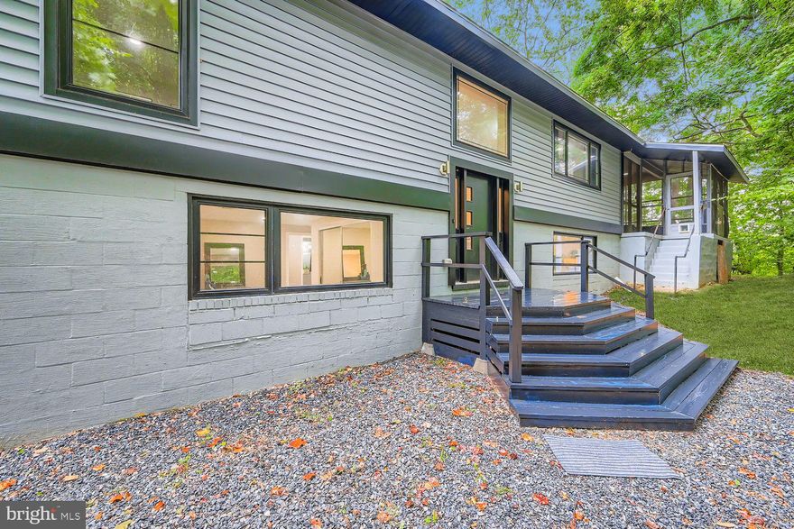 Discover waterfront living on Beards Creek in the sought-after Withern Sea community of Edgewater! This beautifully renovated split-level features 4 bedrooms, 2 full baths, modern updates throughout and sits on 2.10 acres. Enjoy wooded privacy, a private dock, and outdoor living spaces including a large, screened porch and fire pit—perfect for entertaining. Inside, you’ll find gleaming hardwood floors, two fireplaces, and an open, inviting layout. Ample parking makes hosting easy. Major updates include: roof (2024), HVAC (2022), water heater (2022), flooring (2023), and dock with stairs/landing (2022). A rare opportunity to own a move-in ready waterfront retreat with charm, updates, and room to grow! 
Bonus: property includes a .62-acre wooded lot across Brezina Place AND property comes with plans for an addition which has already been perc tested for the addition. It is also part of the Chesapeake Bay Restoration Fund, which covers the majority of costs for installing a brand-new septic system, which will be required if an addition is added.