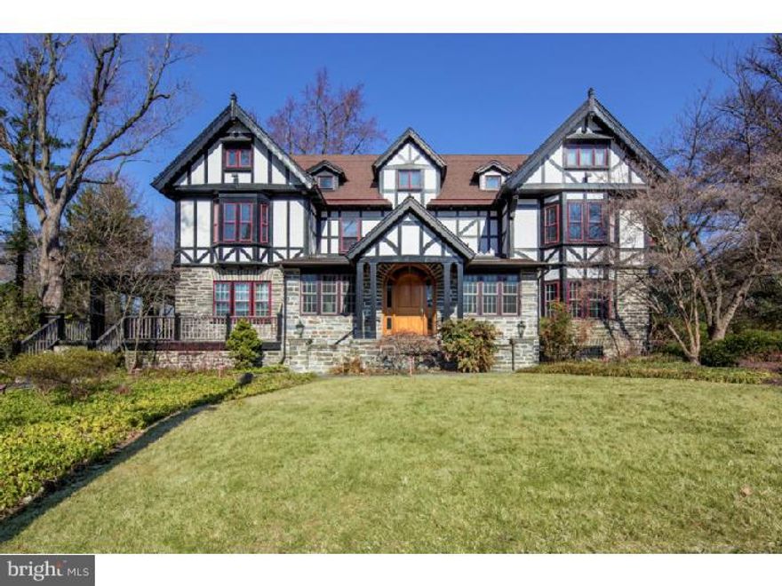 Introducing 201 West Chestnut Hill Avenue; this grand 3-story stone, stucco and timbered Tudor is ready for you to move right in. Large rooms, unique spaces, original details and modern updates give this home a warm and gracious feel. From the beautiful front entrance, large living room with fireplace and views of the grounds, formal dining room with fireplace, cozy den, bright breakfast room with adjoining deck, updated kitchen with pantry and many original features; the first floor is both spacious for entertaining and convenient for modern day living. The second floor includes a large master suite with fireplace, new bath, and walk-in closet, two additional bedrooms with a new Jack and Jill bath, laundry and a wonderful office with multiple windows looking out onto the fenced rear yard with pool. The third floor offers three additional bedrooms and an updated hall bath. The finished lower level includes a full bath and walk out access to the rear yard and pool; plenty of space for fun and loads of storage. The three car detached garage includes a separate second floor 1 bedroom apartment. Many new improvements and updated systems throughout, hardwood floors, multiple fireplaces, updated windows and the list goes on. Fantastic location; just a short stroll to Germantown Avenue shops and dining, easy access to the Chestnut Hill East and West Lines, and neighboring Fairmount Park. This is a classic Chestnut Hill home in excellent condition; don't let this one get away.