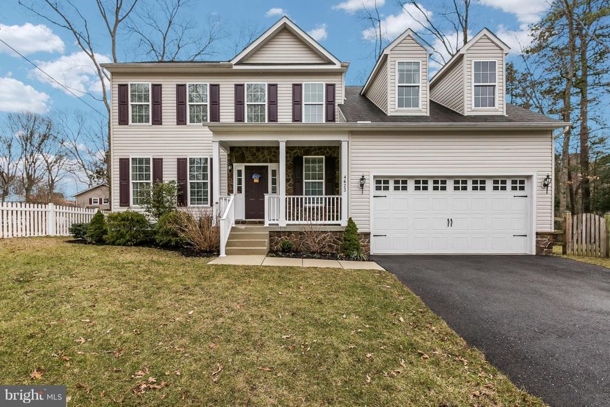 Colonial in Boulevard Park shows like a model home. 4 bed, 2.5 bath has hardwood floors in foyer, kitchen, dining room, & family room. Open floor plan from the family room to kitchen. Features include kitchen island w/ granite counters, stone fireplace, double vanity in master bath, finished basement w/ great storage, fully fenced yard, & 2 car garage. COMMUNITY WATER ACCESS & PLAYGROUND