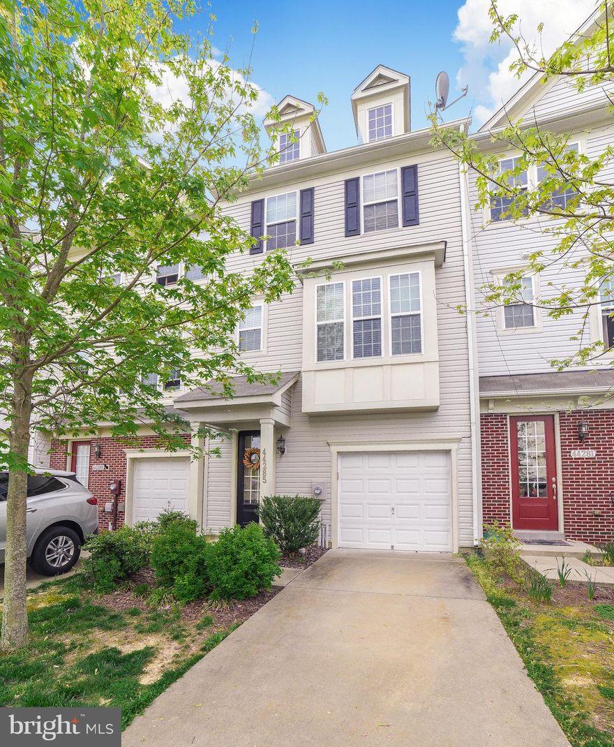 Why rent when you can own!! MOTOVATED SELLER -PRICE IMPROVEMENT AND 3% CLOSING HELP OFFERED WITH ACCEPTED OFFER!! -Well maintained townhome on a premium lot (backs to tree lined area) in the Woodland Park section of Wildewood.  Three finished levels that show the pride of ownership.  Entering the first level there are hardwood floors and a bedroom/flex room with bath and access to the one car garage.  The second level offers an open kitchen and living space complete with hardwood floors throughout, crown molding and half bath.  Grill on the large, maintenance free deck and enjoy the view!!  The third level is complete with a master suite with bath and walk-in closet, and two additional bedrooms and bath.  Stroll or bike to enjoy the community amenities   pool, ball fields, tennis courts, basketball courts, and play grounds, all of which are included in the HOA fee