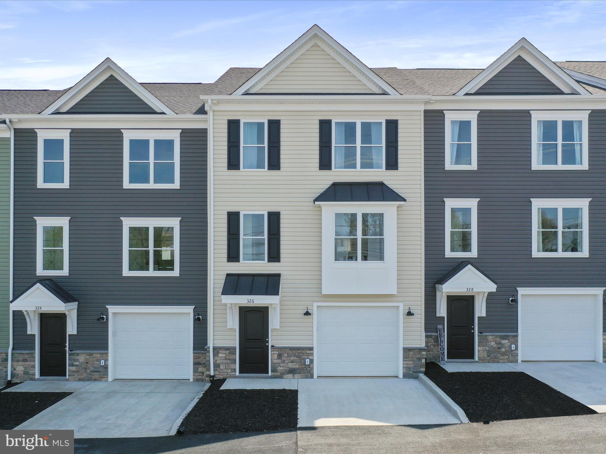 Brand new 3 level townhomes! Ready for immediate occupancy! 3 Large bedrooms 3.5 baths, family room with full bathroom in basement. The builder has added all the extras! Trex rear deck with privacy panels on rear decks! In home office offers Xfinity high speed internet. Smart car outlet located in 1 car garage. Stainless steel appliances, quartz countertops, tile floors in bathrooms, and NO HOA fees!