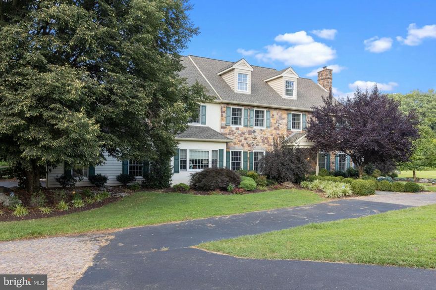 Welcome to this elegant Custom-Built stone front Center Hall Colonial set on 10 acres in Bucks County /Council Rock School District.  With its unmistakable charm, rich history, and storybook streets, Bucks County has no shortage of beautiful towns, communities, and homes!  Original owners take much pride in their home of 33 years.  Total privacy and serenity!  Take the long tree-lined driveway to your estate home with circular drive.  Approximately 6000 square feet on the interior comprised of 6 bedrooms and seven bathrooms.  Slate front walkway to stylish front door with portico.  Once inside, each room is spacious yet cozy.  Lots of hardwood flooring, decorative molding and wainscoting... and FOUR fireplaces.  The kitchen is positioned in the rear of the home and large windows overlook the backyard acreage, patios, and swimming pool.  Family room has vaulted ceilings while the focal point being the floor to ceiling stone fireplace.  Living room with fancy wall and ceiling molding, fireplace with marble surround and white mantle.  Dining room is large and great for entertaining holiday dinners.  An office /den is adjacent to dining room and is my favorite room in the house; having a fireplace with brick surround and brick hearth and built-in bookshelves.  A second office overlooks the backyard and great vistas. In addition, the main level has a special room that houses the spa; a hot tub surrounded by sliding glass doors and skylights.  On level #2 find the Master bedroom with sitting area and fireplace having wood surround and mantle, two large walk-in closets with custom built-ins, and luxurious and UPDATED master bathroom; high ceilings, skylight, double vanity, oversized shower, and soaking tub.  Off Master bedroom you’ll find an amazing laundry room with area for storage.  Also, on this level; three additional spacious bedrooms with large closets and two nicely finished bathrooms.  Level #3 was finished to accommodate two additional bedrooms with their own bathrooms.  Lower level is finished with recreation room, bathroom, and so much space for any kind of storage.  Outside includes inground swimming pool, multi-level stone patios, pool house, mature gardens, koi pond, and additional out building.