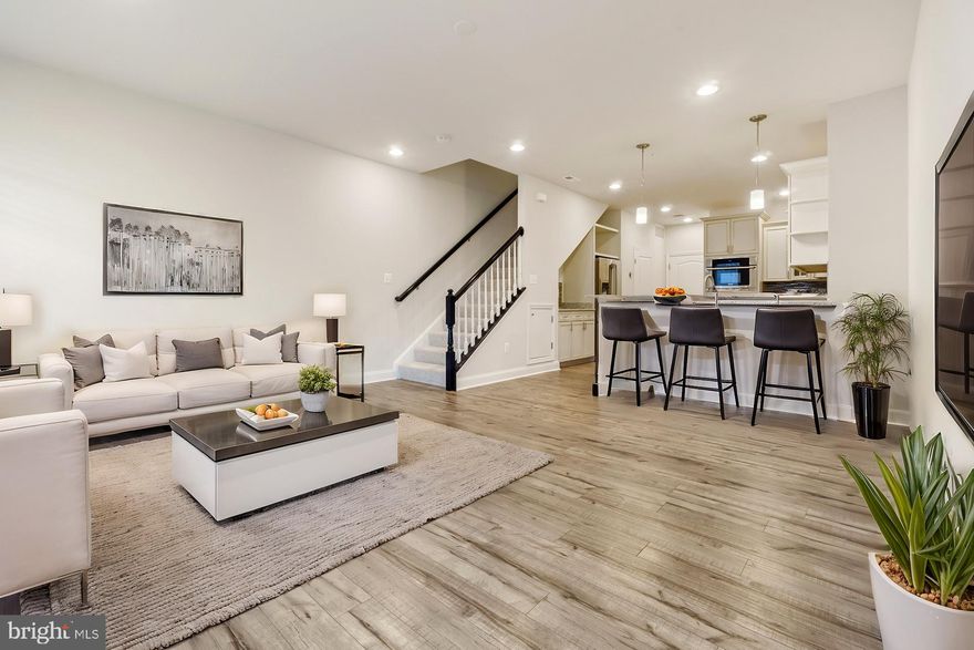 ** New Price ** Welcome to this stunning 3-bedroom, 2.5-bath townhome with a 1-car garage in Howard County’s highly desirable Oxford Square community!
Designed for modern comfort and style, this home boasts a gourmet kitchen that’s a true chef’s delight. Featuring sleek stainless steel appliances, a five-burner gas stove, a built-in oven and microwave, and high-quality cabinetry and countertops, it’s perfect for both everyday meals and entertaining. For added convenience, the garage is located right next to the kitchen, making grocery unloading effortless.
The spacious living and dining areas are bathed in natural light, thanks to large windows that enhance the home’s bright, open feel.
Upstairs, the primary suite features elegant tray ceilings, a private balcony, a beautiful bathroom, and a generously sized walk-in closet.  The laundry area is conveniently located in the spacious hallway on the upper level for easy access. Two additional well-sized bedrooms provide flexibility—ideal for a home office, guest room, or creative space.
This immaculately maintained, move-in-ready home is waiting for you. Don’t miss this incredible opportunity!