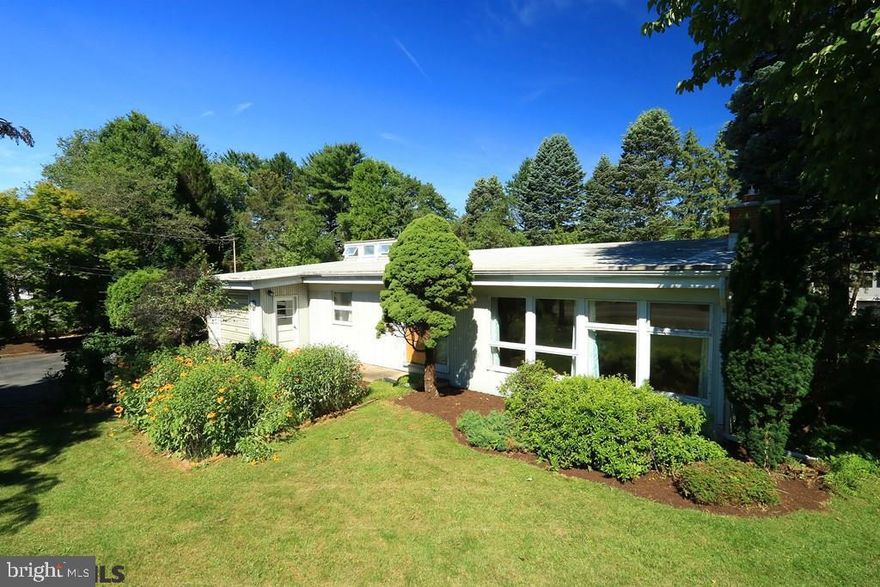 This unique contemporary home sits on a beautifully landscaped half acre lot and features a spacious open floor plan with the perfect mix of thoughtful updates and vintage charm! The home has hardwood floors, an eat-in kitchen, renovated bathroom, central air conditioning and attached one car garage and greenhouse. The great room is filled with natural light from the large front windows and vaulted ceiling and warmed by a fireplace with wood stove insert. The unfinished walkout basement has room for storage, laundry, and a workshop or hobby area. Fruit trees, berry bushes, garden plots, unique mature landscaping plants, plus two private stone patios make for a gorgeous setting. Enjoy the convenient location near bike path (a quick ride to campus and downtown State College!). Walking distance to Slab Cabin, Dalevue and Oak Grove Parks, and the Lemont village with local favorite cafes and restaurants, festivals and concerts on the Green, the Art Alliance, trails to Mt. Nittany, and more!