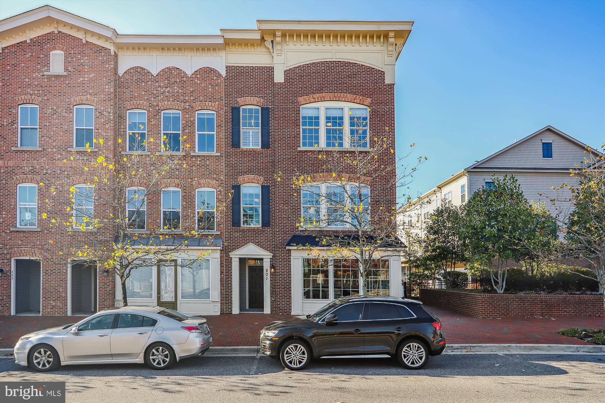 VERY RARE OPPORTUNITY to own one of only 12 specially zoned "Live/Work" luxury townhomes in Village Greens Of Annapolis. These homes offer commercial space store fronts with separate entrances and the opportunity to have a business on the lower level. Initially, you may want to use the space as a family room, a workshop, or an Au pair suite. However, with the special zoning you will always have the opportunity to use it for a commercial venture... Perhaps, a law office or that boutique you've always wanted to open. This particular home is also an END UNIT. With 14 more windows than a typical interior unit you'll have natural light flooding every room! The lower level half bath has also been converted to a full bath with shower. Step into the Gourmet Kitchen and note the stylish contrast between the crisp white cabinetry and gorgeous Wide Plank Hickory Floors. These floors are hand-scraped and cover the entire main level. Quartz contertops, Stainless Steel appliances, under cabinet lighting, and a fully tiled backsplash add the finishing touches to this fabulous kitchen. Crank up the music throughout the home with a 4-zone Bose Surround Sound System. Exterior Bose speakers will drench your deck with hot tunes, but the composite surface will remain cool under the remote controlled 10'x20' Sunsetter Awning. Hunter Douglas Shades cover all windows and an Epoxy Finish covers the garage floor... with a Lifetime Guarantee! The Primary Bedroom offers a comfortable sanctuary with a well designed walk-in closet and ensuite bathroom with jetted tub and separate shower. A wall mounted Dimplex Opti-Myst fireplace will mesmerize you for hours! Special features can be found throughout the home and are too numerous to list here. BE SURE TO REQUEST the "Full List of Features". Additional photos, room dimensions, and wall measurements can be found in the VIRTUAL TOUR. Pool and other amenities available with Berkshire Annapolis Bay membership. Just minutes from Historic Downtown Annapolis and major commuter routes to Baltimore and Washington DC. You may want to see this one sooner than later! The market is hot and this very unique opportunity will not last long.