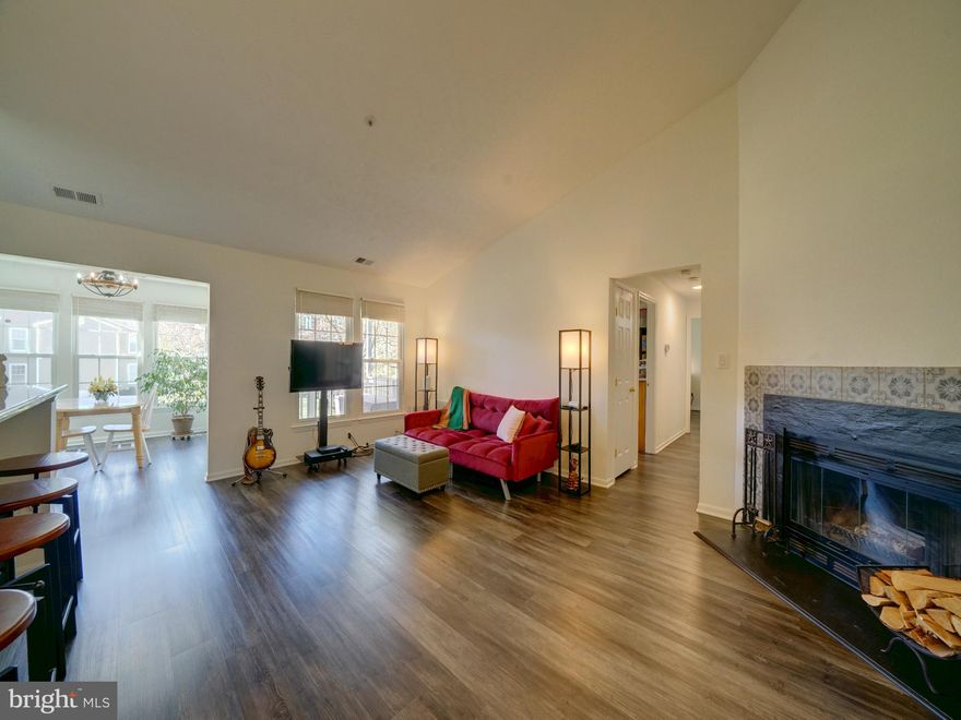 Updated and upgraded! This immaculate, top floor condo features  two spacious bedrooms and two fully remodeled  bathrooms. Open floor plan with cathedral ceiling and fireplace. The separate dining room features natural sun light from the windows and french door to deck. This room could be a great sunroom/family room. Large great room is central and could be used as a living dining combo with the breakfast bar opening to the kitchen. Granite countertop breakfast bar features a pass through to the beautifully upgraded kitchen, with SS appliances, tiled backsplash and painted wood cabinetry. Both bathrooms have been remodeled with tiled showers and upgraded vanities. Convenient separate laundry room not found in many condos with full size washer and dryer and easy access to HWH.  Throughout the home there are LVP floors and custom window treatments including blinds. Enjoy the covered deck  with ample room for outdoor seating, to enjoy the wonderful treed courtyard.  
Located in Elkridge with easy access to major roadways, MARC train station, BWI airport and plenty of shopping. The Elkridge Library and local recreational parks are very popular. Minutes to NSA/Ft Meade, BWI business district and popular location for commuters to both Baltimore and Washington. This home will not last long. Call your Agent today for a private tour.