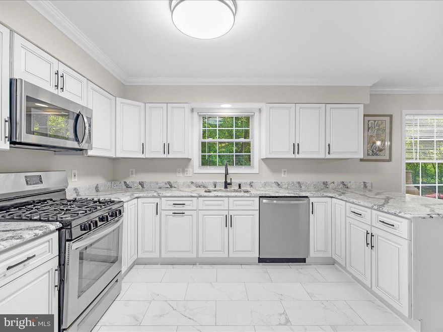 AGGRESSIVELY REDUCED. MOTIVATED SELLER.

Nestled in a serene and private setting, this tastefully updated home in Annapolis offers an ideal combination of modern amenities and natural beauty. The heart of this inviting residence is its fully updated kitchen, complete with brand new stainless steel stove and dishwasher, and a sleek renovation completed in August 2024. Step onto the newly laid hardwood floors that grace the entire main level, adding warmth and elegance to the spacious interior. The cozy gas fireplace becomes a focal point for group gatherings or quiet evenings. 
With four generously sized bedrooms and two and a half well-appointed bathrooms, this home caters to both comfort and convenience. The large, oversized unfinished basement, boasting high ceilings and an egress window, holds incredible potential for customization, including the possibility of a fifth bedroom. The master bedroom is a retreat in itself, featuring a full bathroom with a tub and a closet for added convenience.
Additional features such as a new HVAC system, a two-car garage, and the inclusion of the washer and dryer with the sale add practical benefits to this charming property. The newer roof and the home's backing to park land ensure peace and privacy, with frequent wildlife sightings adding to its allure. Its proximity to shopping, dining, and major routes makes this home not only a peaceful haven but also a convenient place to live. Welcome to your new home, where elegance meets comfort in the heart of Annapolis. This home is 1.5 miles away from Sandy State Park that has public boat ramps, beach, and parks. You are 10 min away from Naval academy and down town Annapolis. This is a convenient location to Eastern shore, 20 min to DC, NSA and 30 min to Baltimore. Welcome home.