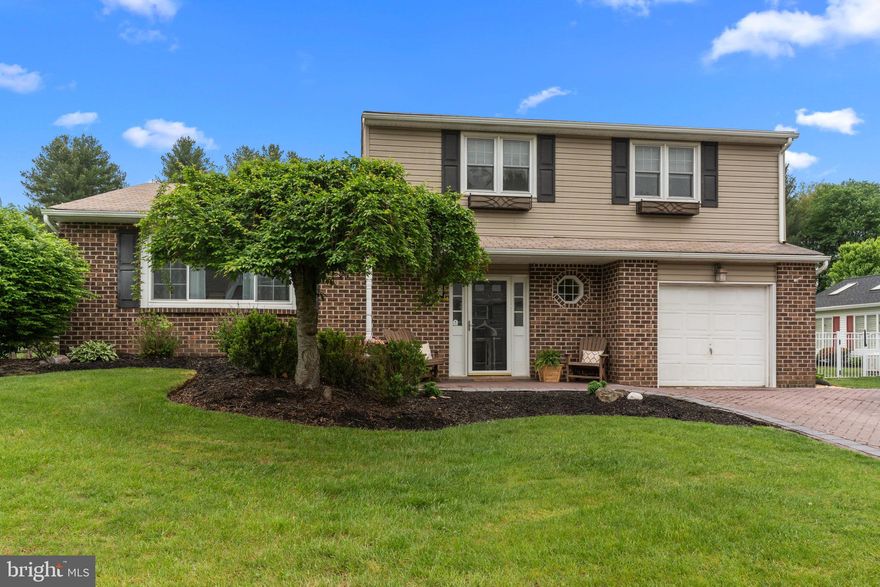 Welcome to 66 Grant Drive, a spacious split level with four bedrooms and two and a half bathrooms in the Hollandale development within the Council Rock School District. Drive up to the house showcasing its brick herringbone patterned driveway and porch. Upon entering, the roomy foyer has plenty of space for taking off coats and shoes.  Choose left to the stairs leading to the large living room or stay level to connect to the family room, access to the garage and laundry and basement. The large kitchen has easy to maintain luxury vinyl plank floors and boasts tons of granite counter space, table space, breakfast nook overlooking the family room, coffee/wine bar, tiled back splash, propane cooking range, stainless appliances, tons of cabinets, recessed lighting and access to the deck for ease of summertime cooking and relaxation. A few steps down take you to the family room with exposed beams, brick fireplace, built ins and the same LVP flooring.  A door leads to the sun-room with walls of windows overlooking the back yard.   Upstairs, the primary Bedroom has double closets and primary bath with stall shower.  There are three additional spacious bedrooms, one with double closets that share a hall bath.  basement is finished with a bar and storage room. The deck off the kitchen overlooks the backyard which is flat, and fully fenced  in.  Beyond the fence is township open space. This is a wonderful home with so much to offer.  Schedule your showing today!