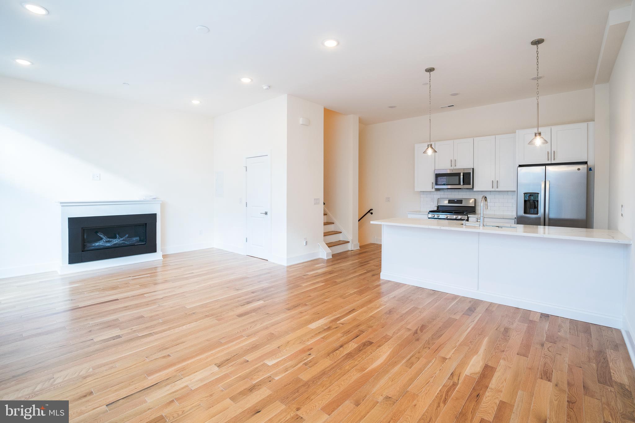 Be the first to live in a massive luxury 3 bedroom, 2 bathroom property situated in the heart of Northern Liberties that is just footsteps away from bustling North Second Street. Upon entering the unit, you will head upstairs to find an incredibly spacious kitchen and living area that has floor to ceiling windows (with window treatments) letting in tons of natural light, access to a private balcony, and a gorgeous fireplace. The modern kitchen boasts overhead designer lighting, subway tile backsplash, a breakfast bar counter, and a full suite of new stainless steel appliances. Up on the second floor, there are two nicely sized bedrooms as well as a laundry closet and a convenient hall bathroom that comes with a shower/tub combination. The third level boasts the master suite that is sure to impress. The huge master bedroom has access to a second private balcony as well as a gorgeous en-suite bathroom that comes fit with a soaking tub, marbled shower, and double sink vanity. It gets even better, as this connects to a large walk-in closet that has built-in shelving for added organization. Finally, be sure to relax on the private roof deck where you can take in beautiful views of the Center City skyline. Additional amenities of this residence include a large coat closet on the first floor, central air conditioning, smart home technology such as a nest thermostat and ring doorbell, and access to garage parking that will be available in June. The combination of expansive living space, luxury features and direct access to one of Philly’s hottest neighborhoods makes this property a true gem – secure it now before it goes off the market!
*2 dogs max permitted with $350 non-refundable pet deposit and $50/mo pet fee. Sorry, no cats.
*Garage parking space available in June for additional $175/mo.