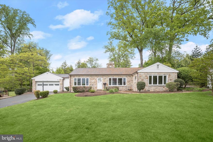 Introducing this inviting rancher-style home in the sought-after Oak Forest community of Catonsville, set on a beautifully landscaped 0.64-acre lot. Offering three bedrooms with two full and two half bathrooms, this sun-filled home features a freshly painted neutral interior and rich hardwood floors throughout. The front living room welcomes you with a cozy gas fireplace, while the formal dining room showcases two corner built-in cabinets that add timeless character. The kitchen provides ample workspace for meal preparation and connects seamlessly to a breakfast room for casual dining, complete with additional cabinetry and a pantry for extra storage. At the heart of the home is the impressive family room, highlighted by a soaring cathedral ceiling with skylights, a striking stone accent wall, and expansive views of the backyard, creating a bright and inviting gathering space. This wing of the home also includes a half bathroom and a mudroom with laundry, offering convenient access to both the garage and exterior. On the opposite side of the home, the private primary bedroom suite features a walk-in closet and an en-suite bathroom with a walk-in shower. Two additional bedrooms and a second full bathroom with a walk-in shower complete the main level. Downstairs, the walk-out lower level offers exceptional potential for future finishing, with ample space to create multiple rooms, along with a half bathroom already in place. An oversized two-car garage includes an additional storage area ideal for a workshop or hobby space. Outdoors, enjoy a peaceful backyard setting with mature landscaping, lush greenery, and a deck perfect for relaxing or entertaining. Located just minutes from the vibrant downtown Catonsville and Old Ellicott City historic districts with a vast variety of locally-owned dining, shopping, and entertainment options. Enjoy community festivals and events, farmers' markets, Five Oaks Pool, Frederick Road Fridays, 4th of July festivities, Patapsco Valley State Park and so much more! Conveniently close to UMBC, CCBC, Downtown Baltimore, and major commuter routes including I-95, I-195, I-695, I-70, BWI Airport, as well as MARC and AMTRAK trains nearby. Life is great in 21228! Some images have been virtually staged.