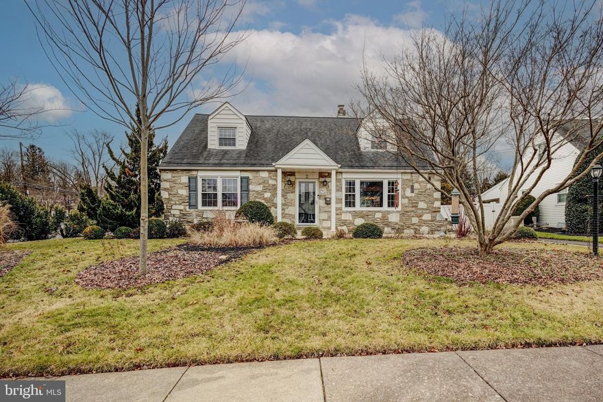 Welcome to this lovely stone-front Cape Cod home in desirable Glenside featuring the coveted Upper Dublin schools. Brimming with natural light and surrounded by meticulous landscaping, this residence offers a comfortable and inviting atmosphere.

Step into the living room with wood floors and a picture window overlooking the front yard. The dining room is generously sized, and the eat-in kitchen features stainless steel appliances and gas cooking. The ground floor hosts two bedrooms and a full bath, making it accessible for easy, one-story living.

Outside, a large brick patio provides a charming space to relax and entertain, with views of a beautiful yard featuring mature perennial gardens and raised beds. A portion of the patio is seasonally covered by an awning.

Storage is ample with a walk-in cedar closet on the second floor, plenty of closet space on the main floor, a waterproofed basement with high ceilings, and an oversized detached garage with additional overhead storage.

Enjoy the convenience of two large driveways for plenty of off-street parking. As a bonus, this home is equipped with a whole-home generator, ensuring confidence during inclement weather.

This home is situated near shopping, restaurants, golf, and swim clubs, with Keswick Village just a short drive away and Septa's Ardsley regional rail station less than a mile from your doorstep. This Cape Cod is not just a home; it's a comfortable retreat in an amazing location. Make it yours today.