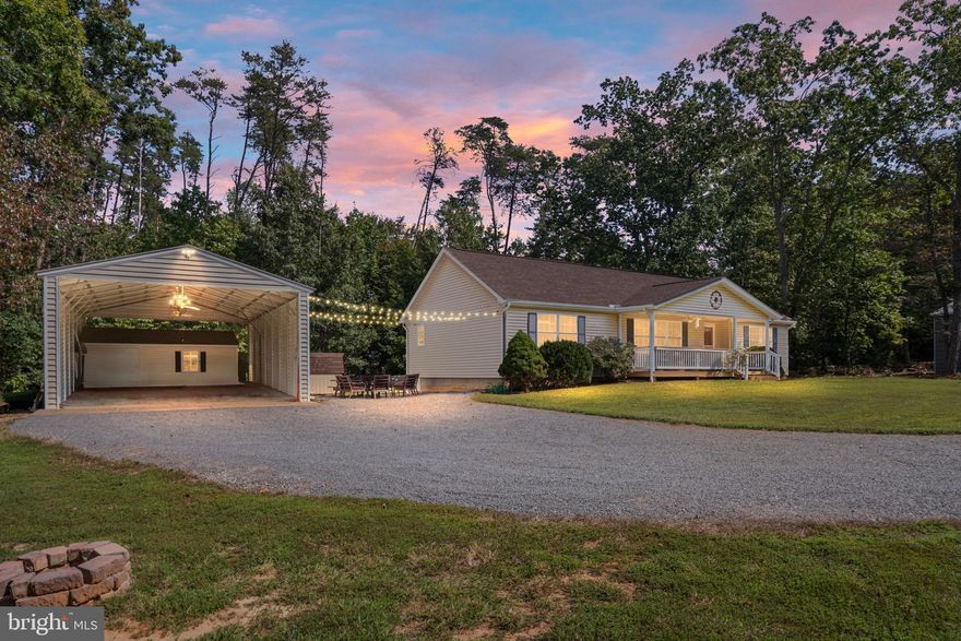 Tucked away in a gated Lake Anna community on the public side, this 3-bedroom, 2-bath home offers privacy, space, and comfort all wrapped up in a peaceful lakeside setting. Whether you're looking for a weekend escape or a full-time place to kick back and relax, this might just check all your must-haves. 
Inside, you'll find 1,584 square feet of easy open floor plan living. The split bedroom layout provides privacy for the primary bedroom and guests. The main living area got a fresh look with new luxury vinyl plank flooring in 2023, and the kitchen features energy efficient stainless-steel appliances updated in 2020—so it’s ready for everything from weekday dinners to weekend pancake marathons. A brand-new roof and water softener installed just this year. Plus, new heat pumps in 2023 help you stay comfy no matter the season. For any storage needs—or future hobby workshop aspirations—there are two sheds and an oversized detached carport. An RV hookup is also ready to go, perfect for visiting guests or your own road trip gear. 
This home is perfectly tucked back off the road, making it easy to relax and soak in the natural setting without feeling too removed. You’ll enjoy that morning cup of coffee on your covered front porch or entertain guests on the back deck. Don’t overlook the firepit, for roasting marshmallow, sharing stories and more!  Not to be overlooked is the community beach and common area—great for sunny days at the water’s edge. Boat lover? Leasing a dock is an option here, so you’re all set to bring the boat and enjoy Lake Anna from the water too, where gorgeous sunrises and sunsets are abundant! Speaking of local perks, just minutes away, you’ll find places like Coyote Hole Craft Beverages and Cooling Pond Brewery and Winery for winding down, plus restaurants like The Cove, Callie Opie’s Orchard and Tim’s at Lake Anna when no one feels like cooking.
So, if you’ve been dreaming about a place near the lake with room to roam (and maybe room for a boat and RV), this home delivers easy living with a low-key vibe. And hey, Lake Anna State Park is nearby if you get the sudden urge to hike, swim, or do some nature watching that the lake is known for. 
Come by, take a look, and see if this lakeside spot speaks your language. This property is not just a house; it's a place where memories are made, and a community where you can truly feel at home. Bring your sandals—you might not want to leave.