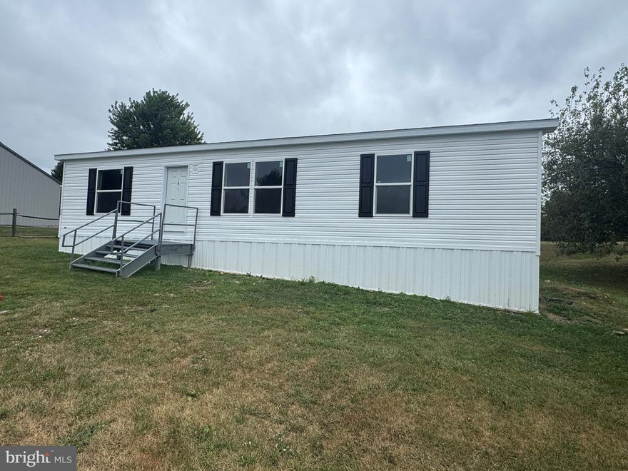 Brand new 2025 3-bedroom, 2-bath manufactured home. This manufactured home features a large living room, kitchen area, and has a master bathroom and walk-in closet in the master bedroom. All new stainless appliances. Ready for a new owner! You don't want to miss out on this one! Lot rent is $350 a month. Buyer must receive community approval prior to settlement. Buyer has 3 months to install porch of their choice or porches are available to custom order.