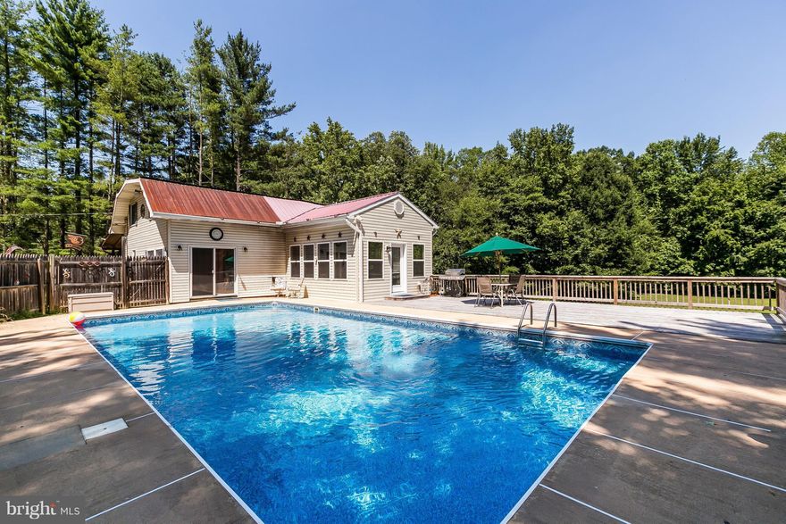 2.47 ACRES OF PARADISE! THIS BEAUTIFUL PROPERTY SURROUNDED BY WOODS W/WINDING STREAM & SMALL POND IS PERFECT FOR THE NATURE LOVER. REMODELED KITCHEN & BATH. 1 YR  FAMILY ROOM ADDITION. 1 YR 38X16 POOL DECK. SPACIOUS MASTER BEDROOM. SPARKLING, HEATED SALT WATER POOL. UPGRADED HVAC & ELECTRIC. LARGE BASEMENT W/PLENTY OF STORAGE. LISTED 15K UNDER APPRAISED VALUE. TRANQUIL & VERY PRIVATE SETTING*