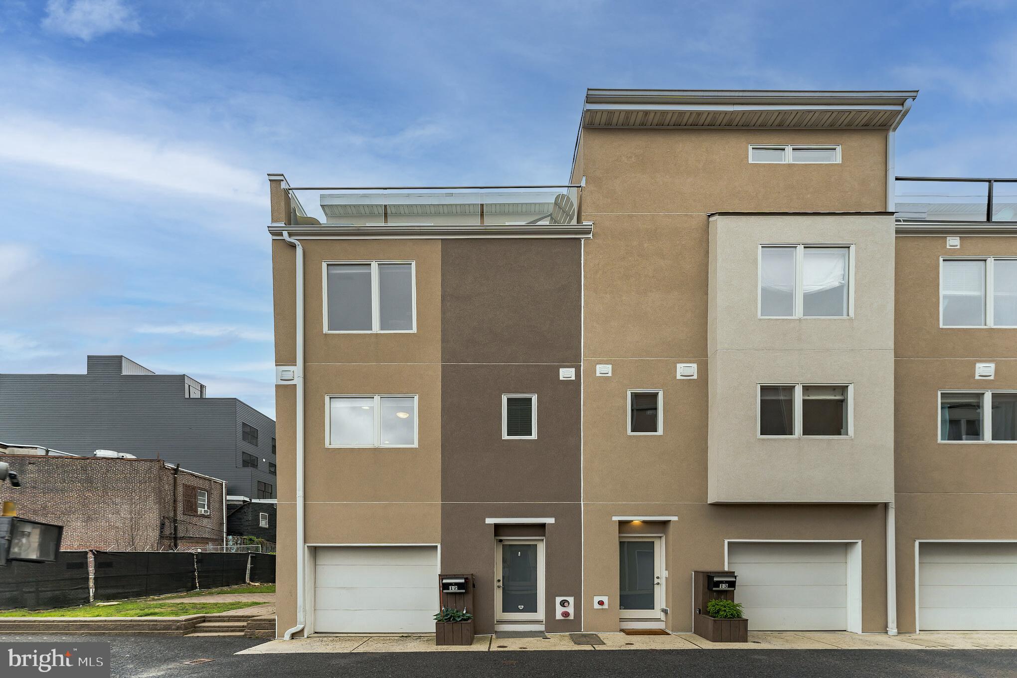 Looking for a modern, spacious home with an open floor plan and GARAGE parking in the hottest location in Northern Liberties? Look no further! A rare find on a quiet street, yet steps away from some of Philadelphia's best restaurants, bars, and shops - this home features over 2,200 square feet, 3 bedrooms, 2.5 bathrooms, multiple outdoor spaces, and upgraded finishes throughout. Enter the home through the foyer, and down the hall you'll find a spare room that is ideally suited for use as an office, den, or second living space. You'll also find access to a private outdoor patio - perfect for entertaining, grilling, or just relaxing in the sun! The garage has custom shelving with space for bikes and a large crawl space for extra storage. The main level has an open floor plan that includes an upgraded kitchen, dining area, living room, and powder room. The kitchen features Caesarstone countertops, stainless steel appliances, and an abundance of cabinet space. The third floor has two large bedrooms with upgraded closets, a laundry room, and a full bathroom. The 4th floor offers a luxurious master bedroom with a large walk-in closet, en suite spa-like master bathroom, and a private deck. This home is an end unit situated next to a secluded greenspace. You'll love the high ceilings, large windows, sunlight and proximity this home provides - a block from Liberty Lands (great for kids and adults) and easy access to highways and public transportation. Schedule your showing today!