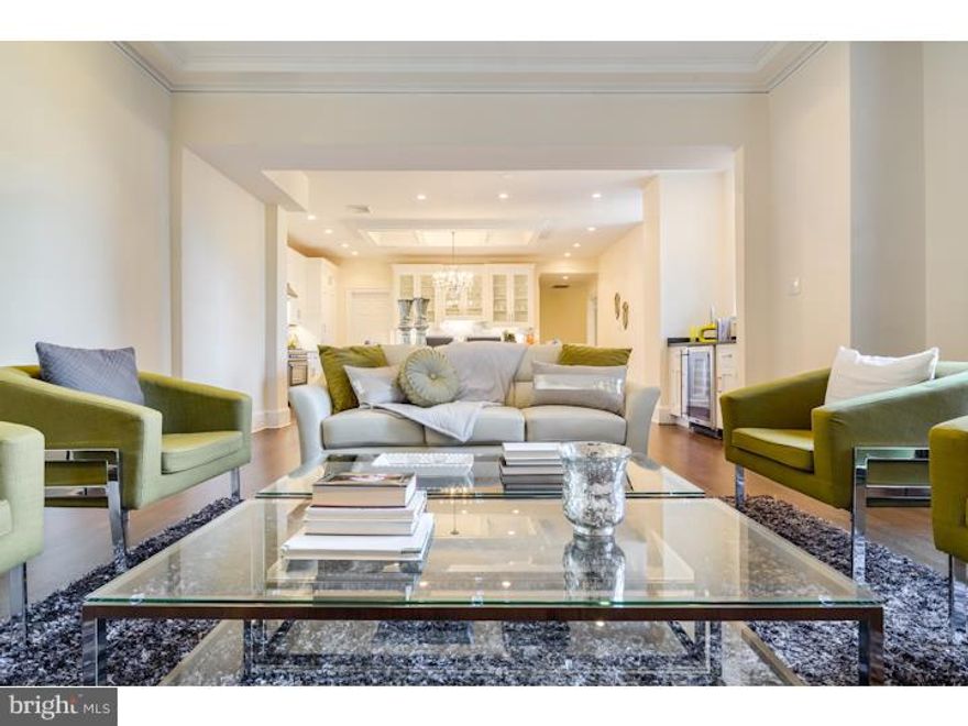 Located on the 18th floor, this elegant 3 bedroom, 2.5 bath condo is the epitome of luxury living in Philadelphia. Completely renovated and just completed in 2015, this never been lived in condo now benefits from a modernized floor plan for the 21st century, charm and rich history. Featuring 2,140 square feet of expansive living space and sweeping views to the South, this condo offers an elegant design ideal for entertaining friends and family alike. With no detail spared, this impressive home is adorned with premium finishes throughout including custom hardwood floors, custom cabinetry and built-ins, and top-of-the-line appliances. Features include oak hardwood flooring throughout, Carerra marble bathrooms, custom built-in entertainment center, gorgeous custom crown molding throughout, laundry room and convenient powder room. The kitchen offers cabinetry provided by Quality Custom Cabinetry Inc., Carerra marble countertops, Bertazzoni Heritage Series gas range with hood and Sub-Zero refrigerator as well as built-in wine refrigerator in the dining room. The large living room provides beautiful city views, and a built-in entertainment area. The fantastic master suite features an oversized custom walk-in closet, expansive Southern views and an en-suite bathroom with glass stall shower with rainshower head and body sprays. An additional bedroom suite offers a walk-in closet, gorgeous views to the South and an en-suite bathroom with Grohe fixtures. The third bedroom is ideal for a nanny/au pair, nursery or office.