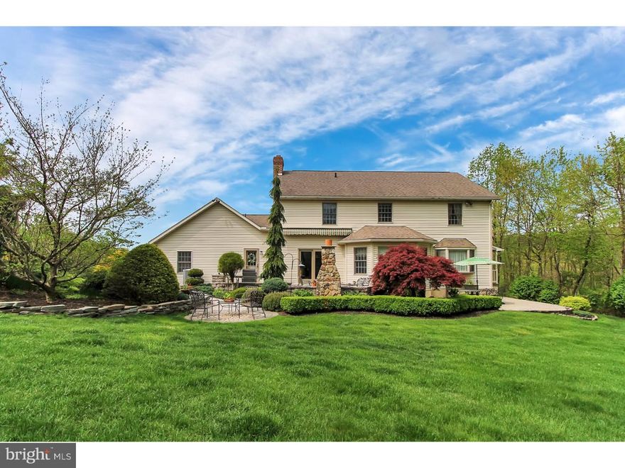 If you want complete privacy, look no further.  This gorgeous, immaculate home is being offered for sale by the original owners, who have meticulously maintained it since it was built in 1994.  Everything about this house says quality from the moment you step onto the flagstone wrap around porch and into the welcoming foyer with its pristine hardwood floors that also adorn the private first floor office and beautiful open concept living room and formal dining room.  The expansive eat-in kitchen is equally impressive with beautiful granite counter tops, tiled back splash, breakfast island, and brightly lit windowed bump out.  The kitchen ties seamlessly into the comfortable family room with a brick wood-burning fireplace, elegant Travertine tile flooring, and a double door walk out to the patio. A convenient laundry room and two powder rooms complete the first floor. Upstairs you will find four large bedrooms and a double sink hallway bath, including a master bedroom suite complete with a walk-in closet with custom built-ins, and full bath with tiled stall shower and whirlpool tub. Downstairs in the finished basement is the perfect game/media/rec room with 800 more square feet of living space to enjoy. Outside you will find mature landscaping on the private 3.75 acre lot, a beautiful paver patio with a stone fireplace, and a roll-out awning - making it the ideal place to enjoy your private back yard.  Then there is the fantastic detached garage complete with its own front porch that is used as a workshop with overhead storage. And did I mention the whole house Kohler generator?  Or the attached oversized 2-car garage? Or the incredible views? Call today for your private showing and make this house yours.