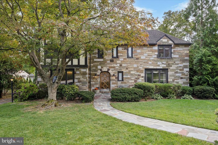 Welcome to 1354 Drayton Lane, a beautiful and meticulously maintained stone Tudor residence nestled on a quiet, tree-lined street in the award-winning Lower Merion School District.  This home offers thoughtful design, premium finishes and abundant light, space and storage across every level.  Its versatile spaces are perfect for family living, entertaining or working from home.  

Approaching the home via its lovely front yard and slate walkway, you enter through a beautiful center hall foyer flanked by a finished powder room and large coat closet. The foyer offers a seamless flow between the generous first-floor spaces - living room, dining room, den, sunroom and kitchen.  These rooms showcase hardwood oak flooring, recessed lighting, crown molding, custom-built mahogany bookshelves, cabinetry and French doors. Additional architectural features include an abundance of windows, including two large bay windows and walls of windows in the sunroom, all of which fill the home with warmth, natural sunlight and beautiful views of the plush outdoor landscape. 

The eat-in kitchen, which features Wood-Mode cabinetry and granite countertops, has direct access to a large, secluded backyard oasis.  With trees, mature plantings, a stone patio, and a dedicated gas line for grilling, enjoy this beautifully landscaped yard for relaxation, play and gardening.

On the second floor, at the top of the stairs you will find a sizeable landing that sets the tone of the second floor which has four large corner bedrooms and three full bathrooms. The primary suite is set apart for privacy and includes two spacious closets, a dressing area, and an updated ceramic tiled bathroom. Each of the other three bedrooms has multiple windows and newly installed hardwood flooring. One of these additional bedrooms also includes an ensuite bathroom and another stands out for its extensive closet space and system. These generous secondary bedrooms are easily adaptable to your needs – for family members, guests or creative use of space for work or hobbies. The upstairs hallway also includes a full bathroom, linen closet, cedar closet and built-in bookshelves.

In addition to the living space on the first and second floors, this home boasts over 1,000+ square feet of space on other levels for storage and other uses. Bessler stairs from the upstairs hallway provide access to a floored attic, which contains not only open space but also a finished closet for storing seasonal clothing. The lower level includes a large recreation/playroom space, a separate laundry area with a full-length wall of storage cabinets with shelving, and an unfinished area that includes a door leading to your private driveway.

This exceptional property offers elegance, great space, and an unbeatable location.   Move in and enjoy this home - ideally situated in a great neighborhood, walking distance from parks, the library, top-rated schools, houses of worship, and public transportation, with easy access to shopping, businesses and a convenient commute to Center City.