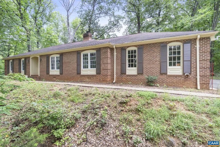 PRICE IMPROVEMENT!!! Discover untapped potential in the heart of Western Albemarle! Tucked away on 3 private acres with no HOA and true one-level living, this classic brick ranch offers a rare opportunity for the right buyer to bring fresh vision to a solid, well-loved home. I've included a few versions of possible improvements here in the photos! With generous room sizes, a traditional layout, and no stairs, it?s ideal for all ages and stages?from first-time buyers to downsizers seeking main-level convenience.  The backyard invites dreams of lush gardens, evening bonfires, and peaceful mountain sunsets?all just minutes from award-winning schools, King Family Vineyards, and some of the region?s finest equestrian estates. Nestled at the foot of the Blue Ridge Mountains, this home is a quiet retreat with incredible potential.  Whether you?re looking for a place to renovate and customize or simply want a livable home in a prized location, this diamond in the rough is ready for its next chapter. With the right touch, it could shine as an elegant country haven.,Cherry Cabinets,Granite Counter,Fireplace in Den