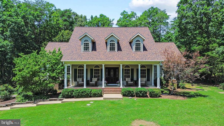 OPEN SUNDAY JULY 27th 12-3PM - This home can be the perfect multi generational home, with two primary suites, one on each level.  The home offers 4 bedrooms, 3.5 baths.  Once you step on the expansive front porch you will know how special this home is. The main level is the perfect place for entertaining and welcoming guests with the large entry foyer which leads to the formal living and dining rooms all with beautiful hardwood floors that have just been refinished.  The kitchen offers a large island and beautiful brick feature around the high end range, stainless steel appliances and new lvp flooring.  There's a large breakfast area also with hardwood floors.  The family room offers cathedral ceilings, a wonderful fireplace and brand new carpet.  The main level primary is large and offers an expansive primary bath with a brand new luxury tiled shower.  The expansive closet offers lots of room for your wardrobe. The first floor office is the perfect spot to work from home  with lots of windows for natural light and Fios high speed internet at your service.  The main level laundry is very large with lots of room for storage.  Upstairs you'll find the second possible primary with large closet and full bath.  There are two additional bedrooms with a Jack and Jill bath.  You'll even find a large unfinished attic space for possible additional living space or storage.  The entire home has just been painted and new carpet and flooring installed. The basement is unfinished and offers incredible possibilites for even more living space.  Out back you'll find a beautiful inground pool with a brand new pump waiting for you to enjoy the rest of this summer.  The home sits on 2.08 acres and backs to National park land for unparalled privacy.  Just moments off Rt 3 and close to I95, shopping, Publix, Riverbend High School, Mary Washington ER, Spotsylvania Hospital ER and so much more.  You will love to call this Home.