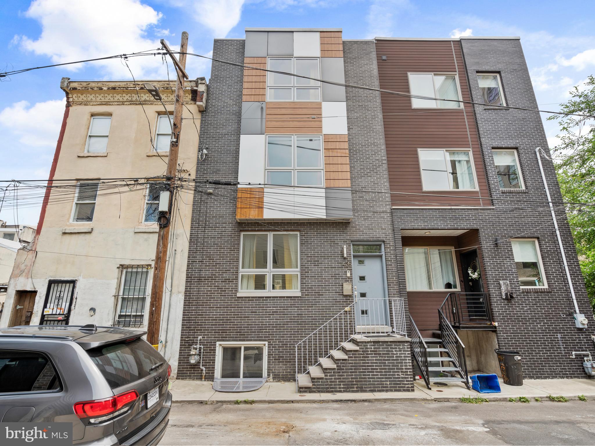 Welcome home to this extra wide townhome in the heart of Olde Kensington. This spacious and beautifully designed 4-bedroom, 3-bathroom residence offers the perfect blend of modern amenities and classic charm across four thoughtfully finished levels.
You won't be sacrificing layout with first floor living and dining, with space to spare.
The second floor features two generously sized bedrooms, each with walk-in closets and abundant natural light. A stylish full bathroom and a spacious deck—perfect for morning coffee or evening relaxation—complete the level.
Retreat to the third-floor main suite, where you'll find a sun-drenched bedroom, large walk-in closet, two additional closets, and a luxurious en-suite bath with dual vanities, an oversized tiled shower, and contemporary finishes. Just above, enjoy panoramic sunrise-to-sunset views from your private roof deck.
The fully finished lower level adds incredible versatility, offering a spacious den or office, full bathroom, laundry area with full-size stackable units, and a private rear bedroom with ample closet space—ideal for guests, a home gym, or an in-law suite.
Additional highlights include dual-zoned HVAC, recessed lighting, and thoughtful storage throughout. All of this is just steps away from Fishtown, Northern Liberties, restaurants, cafes, and public transit. The property is perfect for those needing extra space, with room to grow, or as an investment property with private spaces for roommates. The home has been fully painted, and impeccably maintained.
Don’t miss your chance to own this exceptional city home—schedule your private tour today!