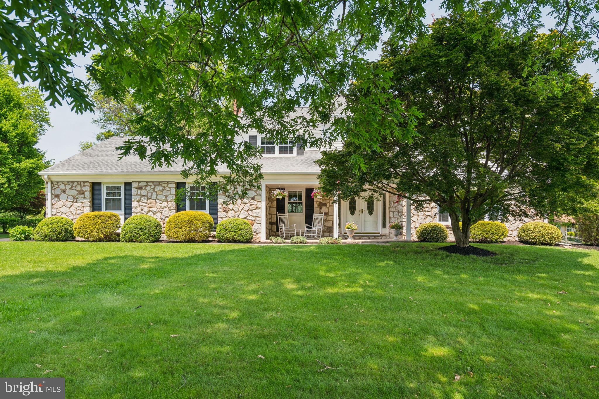 Sitting atop an expansive open grassy knoll with exquisite manicured lawns and stunning mature landscaping is 5615 S Deer Run Rd. This meticulously maintained home boasts over 3200 square feet of incredibly spacious, comfortable rooms and is ideal for seclusion or entertaining as you choose . As you enter through the double front doors into a soaring two story entry you will find a sweeping a spiral staircase leading you to the 4 bedrooms and 2 full baths above the well laid out living areas. Lustrous hardwood flooring encompasses the majority of the first floor which has a been designed for an easy and open layout leading you from one incredibly sunlit spacious room to another. The formal living room has a large picture window overlooking the grassy lawn, through the living room into the generously sized formal dining room that is also directly accessible to the updated chefs kitchen with hardwood cabinetry, stainless appliances, kitchen island, coffee/dry bar all with plenty of room for a table for more casual dining while overlooking the backyard oasis through a large set of sliding glass doors. Once through the kitchen you will find a truly enormous family room centered around a wood burning fireplace, built in bookshelves and cabinetry that encompass the entire depth of the home from front to back where there is another set of sliding doors allowing sunlight to cascade throughout the room. Stepping outside the living room and kitchen set of sliding doors you will be immersed into a meticulously curated backyard, incredible freeform heated pool with adjacent spa sunken into custom laid out entertainment areas that were thoughtfully planned and are meticulously cared for. The pool and spa are surrounded by lush landscaping with a tranquil gazebo allowing one and all be immersed in a resort style pool and patio area surrounded by wide swaths of fastidiously kept grass and plantings fit for an arboretum that is encircled in the distance by a large post and rail fenced area to keep both children and pets safe . Once through the family room you'll find entry from the garages and pool area which lead into a convenient first floor half bath, full laundry/mudroom and a quiet, spacious, sunlit home office over looking the serene surroundings behind the home. On the second floor are 4 very spacious bedrooms with a split floor plan. The large primary bedroom with sitting area and room for expansion if ones should choose has an ensuite primary bath with walk in natural stone shower and plenty of closet space as well as a built in convinient dressing station. At the other end of the second floor are 3 well laid out bedrooms and full bath with dual sink vanity and separate water closet and soaking tub and shower. The lower level of the home has been partially finished as a play room, game room or gym and the other portion houses the mechanicals and a workshop. Separate from the home there is an a generously sized outbuilding that is ideal for storage of lawn equipment, seasonal items etc. This is a very rare opportunity to own a truly and one of a kind property that has been extremely well cared for and continually updated under its current stewardship one of the most distinguished parts of Bucks County with an award winning school district.