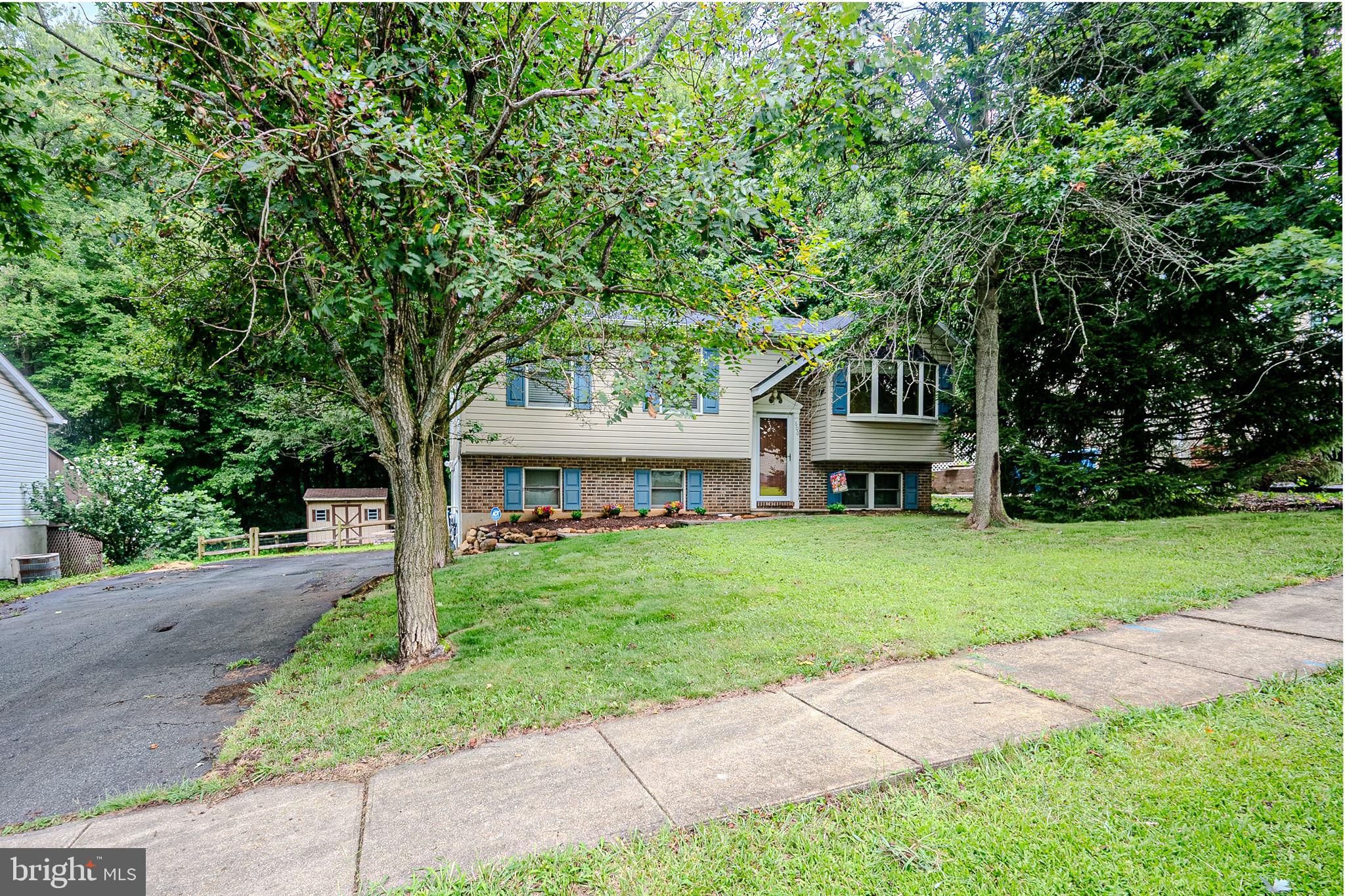 Welcome to this beautifully updated 3-bedroom, 2-bathroom home, offering a perfect blend of comfort, style, and functionality. Gleaming hardwood floors flow throughout the main living area, creating a warm and inviting atmosphere. Step into a bright and airy living room filled with natural light from the large bay window. The adjacent dining area seamlessly connects to a spacious deck and fully fenced backyard, ideal for entertaining. Enjoy the views of the wooded community open space directly behind the home, providing privacy and tranquility. The modern kitchen features stainless steel appliances, including a brand-new French door refrigerator and Bosch dishwasher. Three comfortable bedrooms and a full bath complete the upper level. Downstairs, you'll find a finished bonus room—perfect as a family room, office, or guest space—along with a second full bath. Additional lower-level amenities include a dedicated laundry room, utility space, and a versatile workshop with garage door access to the driveway. Outdoor living shines here with a huge deck, custom fire pit with hardscape surround, large storage building, and a new privacy fence—all designed for year-round enjoyment. Conveniently located just minutes from shopping, dining, and major commuter routes Rt. 40, and I-95. This move-in ready home offers everything you need and more!
Notable Updates:
2025: New roof, HVAC with electric air filter & UV light. New carpet in the nursery.
2024: Refrigerator, dishwasher, select light fixtures.
2022: Hot water heater, privacy fence
2020: Post and rail fence
2019: Water meter