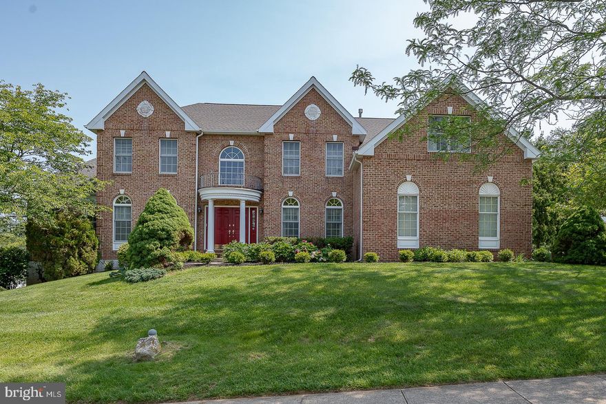 Welcome to 627 Olympia Hills Circle, a spacious colonial with over 6,000 sq ft in the highly sought after community of The Greens @ Waynesborough. Enter this 2-story foyer with a split staircase, hardwood flooring and "picture frame" molding.  The living room and dining room are on either side - the spacious dining room has a tray ceiling, chair rail and crown molding - perfect for entertaining.  To the left is the living room with hardwood floors, crown molding, wainscoting and double doors leading to the expansive game room as well as doors leading to the music room/study. The large Conservatory has a Cherry wet bar, hardwood floors and ceiling fan. The music room or study has a lovely bay window with a window seat. Head to the back of the house, the 2-story family room is clearly the focal point of the home with a beautiful stone gas fireplace, skylights and a ceiling fan. The gourmet kitchen has upgraded stainless steel appliances, including a commercial gas cooktop, double ovens, dishwasher, and refrigerator. There is a large island with granite countertops and an additional island opening to the family room. The spacious breakfast room with a ceiling fan, skylights and a wall of windows overlooks the large wrap around deck. The 1st floor is completed with a powder room and mudroom leading to the 3-car garage with a side door and entrance to the house.  Head up the front or back stairs to a spacious landing with a balcony that overlooks the family room. The spacious Primary Bedroom has a coffered ceiling, sitting room, ceiling fan and three oversized closets - one that was converted to the laundry room.  The Primary Bathroom has double vanities, soaking tub with jets and stall shower.  There is an ensuite bedroom with a double closet, ceiling fan and a bathroom with a tub. Lastly, there are Jack and Jill bedrooms with a bath. Don't miss the amazing walk out basement with a bedroom, full bath, Kitchenette, built-in home office and new vinyl plank flooring - perfect for in laws or guests - their own apartment- they may never leave!!This home has brick and wood siding - NO STUCCO!! It is located in the award- winning T/E School District and is conveniently located to all major highways and everything the Main Line has to offer. A perfect home with all of the amenities for today's lifestyle!