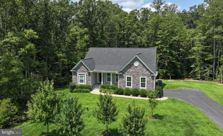 Welcome to the Retreat on Ashford, a home designed for buyers who value peace, space, and intention.

Set on a quiet, low-traffic street with natural distance between neighboring homes and mature trees providing privacy, this property offers a true sense of refuge without feeling remote. Traffic noise disappears, the pace slows, and the setting feels deliberately removed, yet shopping, dining, and daily conveniences are just a ten-minute drive away.

Built in 2022, the home delivers the appeal of new construction without the wait, uncertainty, or expense of building today. Thoughtful upgrades reflect a focus on livability, including custom built-in closet organizers in the primary suite, a full central vacuum system, whole-house water treatment, and an irrigation system supporting the landscaped grounds.

The primary amenities here are quiet, privacy, and room to breathe, both indoors and out.

This is a perfect property for those who want separation from the hustle and bustle found around typical developments, while still remaining comfortably connected to everything that matters.