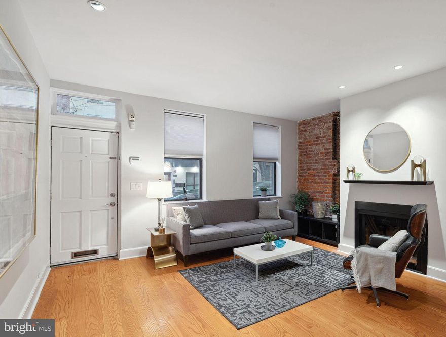 Gorgeous 3 bedroom, 2.5 bath townhome w/ endless outdoor space, bricked garden and PARKING for multiple cars.  Centered on one of the best and most convenient blocks of the popular Graduate Neighborhood the home covers a 16x102' street-to-street lot offering tremendous outdoor space.  Bright, open and spacious living, dining, kitchen main level opens to a circular bricked patio area, fabulous for entertaining.  The first floor offers hardwood floors, coat closet, powder room, wood burning fireplace and exposed brick detailing. The renovated kitchen is a chef's delight highlighted by natural Cherry cabinets, stone counters, glass tiled backsplash and stainless appliances.  A counter height built-in peninsula offers breakfast bar space and extra work surface.  Triple paned glass doors slide back to allow access to the extra deep lot and bricked garden with mature tree and plantings.  There is open parking for one or more cars, a rarity in any city neighborhood.  The second floor houses two bedrooms separated by a full spa-like, luxurious bath with gleaming glass tiles.  The South facing bedroom with bay window is washed with sunshine all day and both bedrooms are carpeted for comfort and have good closet storage.   The top floor with privacy door creates a primary bedroom suite complete with an efficient main bath.  The wide open space features bamboo floors, high ceilings with skylights, a wood burning fireplace and south facing sliding glass doors to your own private roof deck.  The huge basement is ready to be finished for extra living space or provides loads of storage as well as housing mechanicals.  Stackable modern laundry is conveniently located on the second floor.  The house is accessible to PENN, CHOP, Jefferson, Comcast, the Center City Core as well as parks, community gardens, running and biking trails.  Located on a wonderful residential block just steps from Fitzwater Bagels, Ultimo Coffee, Sabrina's, Ants Pants, City Fitness,  and convenient to Heirloom, Sprouts, and South Square markets.  Just one block from Chester Arthur Elementary - the home offers an incredible urban lifestyle - "Walker, Rider and Biker's Paradise"...Come see this lovely home today!