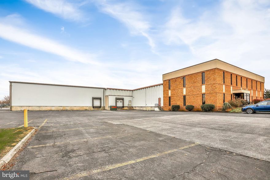 2 story commercial building with 32,000+/- sq ft on 1.77 acres zoned Medium Manufacturing.  5900 +/- sq ft of refrigerated warehouse space, secured/fenced-in lot, 6 spaces for trailer parking, 30 spaces for car parking, 2 dock doors and 1 drive-in door.  Only 2 miles to Interstate 81. Covered outside storage, dry warehouse space, and office space.