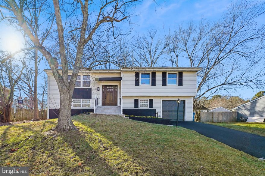 Beautiful split foyer completely remodeled from top to bottom featuring 4 bedrooms 3 full baths with 1 car garage. Open floor concept with hardwood and luxury vinyl floors that run throughout the home. Kitchen features island with quartz countertops and all new S/S appliances. Nice primary bedroom on first floor that features custom tile bath. Large  backyard. Located in the sought after Pinefield Neighborhood of Northern Charles County. A Must See!!