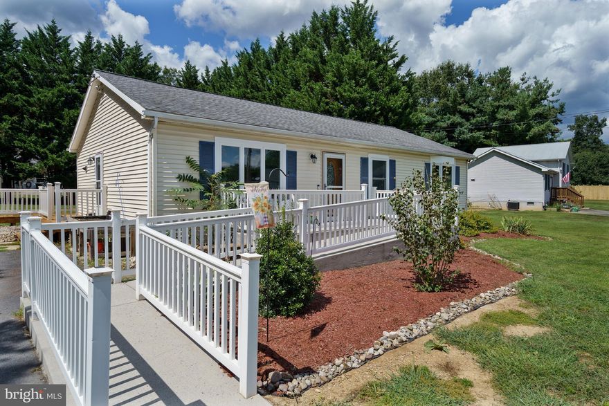 Cute as a button and move-in ready! This charming 3-bedroom, 1-bath rancher in South Berkeley County is just a few miles from I-81 and the Virginia line, making it perfect for commuters. Step inside to a spacious, light-filled living room that creates a warm welcome. The country kitchen with dining table space offers plenty of room to gather and flows right out to a large deck overlooking a private backyard with mature trees and a generous size storage shed. Sunlit bedrooms provide comfort throughout, and the primary bedroom features direct access to a large full bath & laundry area is conveniently located nearby. The home also includes handicap accessibility for ease of living. A wonderful opportunity to own a well-maintained home in a commuter-friendly location!