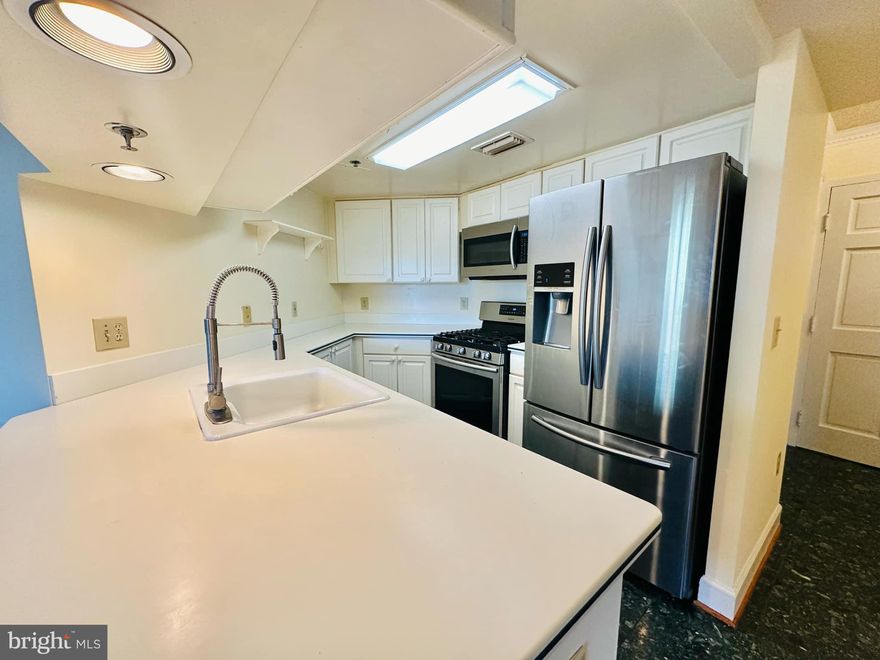 Rare end unit wrap-around balcony with southern views.  It is a short walk to the metro. The building has full amenities, a pool, gym, garage parking, and concierge. Hurry! It won't last.