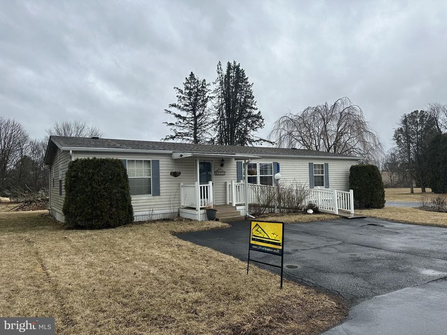 Unique opportunity in Parkland School District. This is a lender owned property and is selling AS-IS. Preference for a quick, cash sale. Potential buyer(s) must be screened and approved by Green Acres MHP. Excellent corner lot with enclosed and covered patio, large storage shed, Lennox heat pump/Central A/C, updated shingled roof, and ramp at front entrance. Annual taxes are approximately $600 with the Homestead discount. Lot rent in this section of Green Acres is $1,082/month and includes water and sewer.