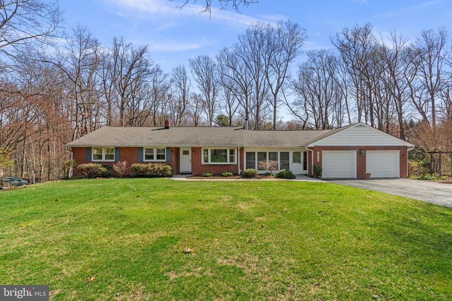 Welcome to 2913 Evergreen Way, a private retreat in the heart of Ellicott City! Nestled on nearly an acre in a picturesque, pastoral setting, this beautiful rancher offers the perfect blend of tranquility and modern comfort. Surrounded by mature trees and natural beauty, you’ll enjoy a true sense of serenity while still being conveniently located.
Step inside through the modern front door to find warm wood floors and a spacious, light-filled layout designed for both everyday living and entertaining. The updated kitchen is a standout feature, complete with recessed lighting, granite countertops, new stainless steel appliances (2026), tile backsplash, glass pendant lighting, and glass-front cabinetry. Skylights fill the kitchen with natural light. The family room offers a cozy brick-surround wood-burning fireplace and additional skylights, creating a warm and inviting atmosphere.
The home features three generously sized bedrooms and three fully updated bathrooms, including a serene primary suite with an updated bath showcasing a bay window overlooking the peaceful, tree-lined yard.
The fully finished lower level with new carpet (2026) provides additional living space, featuring a recreation room with a glass slider walkout to the patio, a second wood-burning fireplace, and a full bathroom.
Enjoy seamless indoor-outdoor living with multiple spaces to relax and unwind, including a charming front screened-in porch, a lanai-style enclosed porch, and a rear deck. Oil heating helps keep electric bills averaging approximately $120/month, and the home is equipped with a water treatment system. With no HOA, a spacious two-car garage, and a setting that feels like your own private escape, this home is truly a rare opportunity.