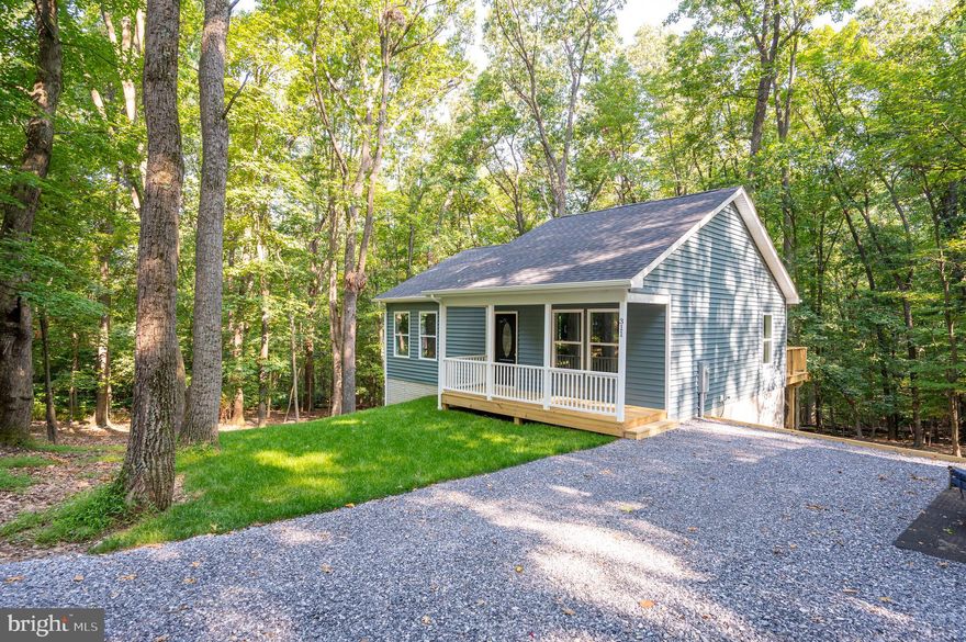 Beautiful new and FINISHED  home in Shannondale, 2BR 2BA, partially finished basement, over 1500 sqft. of finished space,cathedral ceilings, LVP flooring, includes 12 x12 deck, covered front porch, Sodded front yard.
Located on .73 acre wooded lot in Shannondale - close to the Lake,  trails, Club and more. No HOA on state maintained road.  It's a must see.