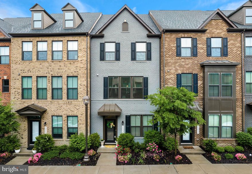 Beautiful 3 level Townhome less than 4 years old, and only 1/2 mile from the upcoming Silver Line Metro!  Projected to open late 2022, move where there are open spaces, lots of green grass & trees, and room to breathe while still having quick access into the City when you want!  Perfect work from home situation or commute to the city!  This lovely townhome is situated in the sought after community of Westmoore with 3 bedrooms, 2 full and 2 half baths, 2 car garage, plus covered balcony!  The first floor entry level greets you with an open recreation room with upgraded carpet and padding, and half bath.  You can use this space however you want – as a second living space, office space, or play space!  The 2 car garage is fully finished, has epoxy floors, and overhead garage storage.  The open concept main level boasts gorgeous hardwood floors throughout, with modern center kitchen and island, classic white cabinets, stainless steel appliances, double oven and cooktop, as well as great room, dining room, and cozy covered balcony on this level!  The third top floor welcomes you to 3 bedrooms, 2 full baths, and laundry room – with a luxuriously appointed primary bathroom with quartz counters, upgraded floor and shower tiles, and dual vanities.  Additional perks include a plenty of storage space, and efficient HVAC system, and bedrooms with walk-in closets!  Enjoy this vibrant community so close to the metro, with lots of walking trails, 2 parks that include a gorgeous and expansive park with an amphitheatre, dog park, tot lots, and plenty of open space, a community pool, a clubhouse with a fitness center. Live in a FANTASTIC LOCATION! – not just close to the Silver Line Metro, but also every day conveniences like stores and restaurants, but also not too far from One Loudoun, with quick access to the Dulles Greenway and only 12 minutes to Dulles International Airport!