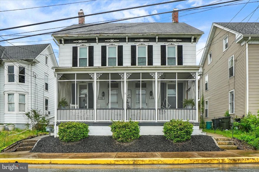 This spacious six-bedroom home built in 1880 offers a perfect blend of charm, functionality, and comfort. Once a duplex, it has been beautifully transformed into one large, inviting residence. The first floor features one bedroom with a faux brick fireplace, two half bathrooms, a dining room, a sitting room, and a large laundry area. Many rooms throughout the home showcase original hardwood floors that add warmth and character. Upstairs, five additional bedrooms provide ample space for family or guests, along with two full bathrooms for convenience. Two of the upstairs bedrooms open onto private balconies, offering peaceful outdoor retreats. The attic is divided into two rooms, one currently used as a music room, providing flexible space for hobbies or storage. Outdoor living is equally impressive, with a side porch, a screened-in front porch, and a backyard oasis featuring a water feature and a stone paver patio—ideal for relaxing or entertaining. The front of the home retains its unique charm with two front doors, a nod to its duplex history. Additional highlights include parking in the rear, a red barn, and two hot water heaters, one of which is less than a year old. This distinctive property combines historic character with modern updates, creating a truly special place to call home.
