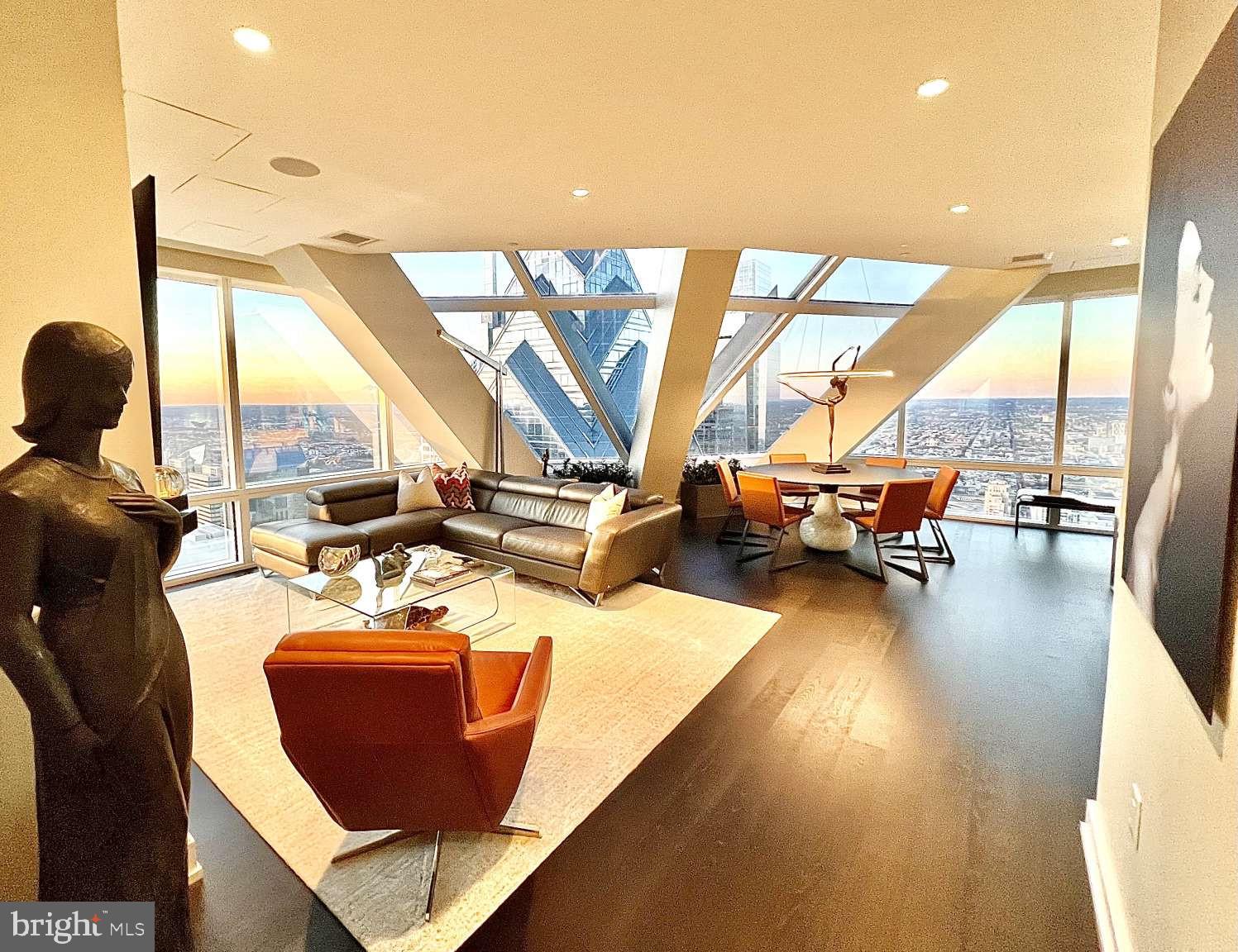 A true architectural masterpiece! Remaining TAX ABATEMENT! The rare opportunity to own a breathtaking penthouse in the sky located in the pinnacle, triangular pencil point of Philadelphia's iconic Two Liberty Place skyscraper. Unit 5602 is one of only four units on the 56th floor and inspires the felling of being a passenger on a super stealth jet with it's picturesque convex and concave windows. The 56th floor is the second highest residential floor in Philadelphia/Pennsylvania and the unit boasts jaw dropping magnificent panoramic views of the city's sunrises and sunsets along the Schuylkill and Delaware Rivers. Your own observation deck in the sky. The spectacular penthouse includes 2 bedrooms and 2.5 baths. The unique open great room floor plan with its oversized Concave window (almost 11ft. tall) with large gas fireplace is ideally designed to separate the main bedroom from the second bedroom/den living space to provide ideal privacy. The chef's kitchen is equipped with Miele appliances, Sub-Zero refrigerator, and wine cooler and is beautifully complemented with Italian made Snaidero white cabinetry. The spacious main bedroom is a visual spectacle with it wall of convex triangular oversized (almost 11 ft tall) windows. Connected to the main bedroom is a well-equipped dressing area with a large, oversized closet. The warm grey/white marble main bathroom includes a walk-in shower, soaking tub and double vanity. The generously sized second bedroom/den has an oversized closet along with a full grey/white marble bathroom with oversized shower. In addition to the two bedrooms , there is a separate area which includes a small hallway that separates a marble powder room from the laundry space. The cleverly designed floor plan positions this area, so it does not interfere with the rest of the living space. Doorman service and 24 hour on site security. Residences of Two Liberty Place are exclusively entitled to access to the NEWLY enhanced renovated (March 2024) 37th floor amenities, including 24 hour gym/locker, endless pool, massage room, yoga studio, sauna and separate steam room. The Amenity floor also contains an oversized boardroom, smaller board room, business center, common area with amazing views and a media/billiard/fireplace and large kitchen entertaining area with spectacular views as well. Residents have direct secure access to the Shops of Liberty Place, Chauffeur driven concierge limousine service, valet parking, self-parking along with access to indoor parking even for your guest, all within the building. A storage locker is included as well. The unit was the model used by the developer to solicit buyers for the Residences of Two Liberty Place when they were first offered to the public. The unit is in flawless condition and is available unfurnished but the owner is willing to discuss the furnishings as part of the purchase.
