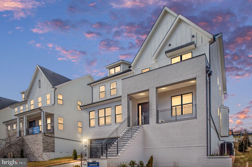 Experience luxury here at The Grove at Dominion Hills – built by America’s Luxury Home Builder, Toll Brothers. This three-level single family home spotlights an elevator to make traveling between floors a breeze. Blonde hardwood flows through the main level emphasizing the open concept layout. The pewter cabinets in the Kitchen are stacked to the ceiling and enhance the gorgeous White Macabus granite countertops and brushed nickel accessories along with the name brand, Jenn Air appliance package. The butler pantry is an extension of the kitchen and provides ample storage opening to the spacious dining room with tray ceiling. Working from home is enjoyable with a dedicated office with glass doors as well as a bathroom with walk-in shower. On the bedroom level, enjoy 3 secondary bedrooms all with en-suite bathrooms. The primary bedroom boasts hardwood flooring throughout with dual walk-in closets and a spa like primary bathroom with soaking tub and spacious shower with glass to the ceiling. The lower level is perfect for entertaining with a large recreation room, ample storage and a wet bar with sink and beverage center. A fifth bedroom is housed on this level as well with large walk-in closet. May/June 2024 delivery! This home is nestled in the Dominion Hills neighborhood of Arlington which was named the #2 neighborhood in Virginia to raise a family in 2023. Come see why Toll Brothers is America’s luxury builder – offering $20,000 closing cost assistance with the use of Toll Brothers Mortgage.