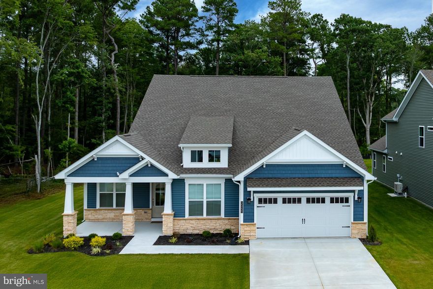 Your coastal lifestyle begins this summer. This beautifully crafted home—now under construction—offers the rare chance to settle into a brand‑new residence just minutes from the ocean’s edge. Located in Sandpiper Cove, an intimate community of only 68 single‑family homes, you’ll enjoy the perfect blend of serenity, sophistication, and convenience between Selbyville and Fenwick Island.
Positioned just 0.7 miles from Route 54 and moments from the Freeman Arts Pavilion, Sandpiper Cove places you at the heart of coastal living while surrounding you with resort‑style amenities. A private clubhouse, sparkling pool, modern fitness center, and scenic nature trails create a lifestyle that feels like a year‑round retreat. This home features the Barlow, our most sought‑after floor plan—thoughtfully designed with 3 bedrooms, 2 baths, and a private study. The open‑concept layout centers around a spacious kitchen overlooking a vaulted great room with a cozy fireplace, creating an inviting space for both everyday living and effortless entertaining. The serene primary suite offers a true escape, complete with two generous walk‑in closets and a spa‑inspired bath featuring a walk‑in shower with a built‑in seat. Throughout the home, you’ll find elevated designer finishes, including: Quartz countertops, Custom tile work, Elegant flooring,Stainless steel canopy hood, Wall oven/microwave combination,French‑door refrigerator with bottom freezer.  Built with wellness and sustainability in mind, this home meets the highest standards of comfort and efficiency, including Indoor AirPLUS® and Zero Energy Ready™ certifications—providing cleaner indoor air, enhanced durability, and meaningful energy savings.
Homes in this highly desirable community are selling quickly. Secure your place at Sandpiper Cove and start living the coastal lifestyle you’ve been dreaming of.  Estimated Completion 7/31/26.