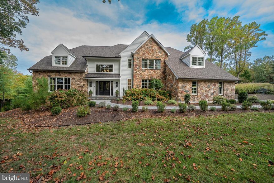 Stunning whole house renovation- better than new with over $1.6 million in custom renovations. Everything on interior and exterior has been thoughtfully and COMPLETELY reconfigured and redesigned with only the finest quality luxury products. This modern farmhouse style executive estate is set on just over two acres with over 6,800 sf of custom living space. From the moment you enter the sun drenched two story foyer you will be awed by this home. The chef's kitchen is surrounded by windows and anchored by a 10 ft island. It feature a Wolf 6 burner stove with griddle and double oven, a subzero refrigerator, Bosch dishwasher, xo wine refrigerator and reverse osmosis water system. The redesigned kitchen is now open to the family room with a stone wood burning fireplace being the central focus. Pass through modern glass french doors from the family room and enter into an adjacent sun filled sitting room/office which overlooks the tranquil pool area outside. A second family room paneled in custom painted poplar moldings with a second fireplace (gas) offers another space to gather. The spacious formal dining room with custom molding completes the circular flow of the home. Off the kitchen and as you enter from the 3 car garage (with new expanded 8ft doors and epoxied flooring) find a tasteful brick floored mud/laundry room and new pantry area with beverage refrigerator drawers and an ice maker making it convenient to grab a beverage on the run. All doors on this level have been thoughtfully increased 1 foot in height to allow more light to infuse each room. Upstairs find a luxurious primary suite with vaulted ceiling, custom walk in closet and dream bathroom with radiant marble flooring, separate marble vanities, a soaking tub, and a walk in shower for two with 3 shower heads and an extensive bench. 4 more spacious bedrooms connected by two jack and jill baths complete with dolomite countertops and walk in showers are on the second floor. A second laundry room was added for convenience on this level. The walk out lower level is an entertainers paradise offering a media space with linear fireplace, full bar with dishwasher, microwave, beverage refrigerator, peninsula seating for 6 with dolomite countertops, surround sound, game area, full bath and a gym area separated by sliding barn doors. This space walks out to the outdoor oasis with surround sound including a salt water pool, hot tub and firepit providing ease of outdoor and indoor entertaining. New landscaping, exterior and interior doors, fencing, Anderson windows, James Hardie Board and exterior stone added, TimberTech decking, exterior lighting, new pool equipment with Heyward OmniLink controller, Lutron lighting and a multitude of so many other upgrades. Truly everything has been thoughtfully done to accommodate today's modern lifestyle and enjoyment of living for even the most discerning buyer. Close proximity to the fabulous restaurants and events in downtown Media and West Chester, only 15 minutes to Westtown School and Episcopal Academy and 20 minute commute to Wilmington, Delaware.  You will be in awe of the attention given to every detail and the stunning luxurious finishes and fine craftsmanship throughout, all with the bonus of low taxes- this home is move in ready on a lovely cul de sac and must be seen to truly appreciate.