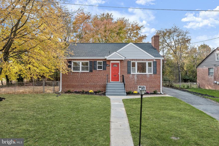 Welcome to this beautifully renovated brick Cape Cod home in a prime commuter location, just a stone's throw away from Washington DC, Northern Virginia, Joint Base Andrews, and the vibrant National Harbor. Situated on a spacious corner lot, this property boasts a fenced backyard with a covered deck, two convenient storage sheds, and the added perk of being adjacent to a community sports field. Step inside to discover the updated interiors with a neutral color palette, hardwood flooring that is being refinished, and recessed lighting that accentuates the open concept living room, dining room, and kitchen. Crown molding adds a touch of elegance to the shared living spaces, while the living room features a wood-burning fireplace and a large picture window, flooding the room with natural light. The kitchen is a chef's dream, offering 42-inch cabinetry, sleek granite counters, stainless steel appliances, and pendant lighting over the breakfast bar. On the main level, you'll find three bedrooms, including the spacious primary bedroom, and a fully renovated bath with a modern, hotel-inspired design. Upstairs, a loft area, an additional bedroom, and ample storage in the eaves provide flexible living spaces. The finished lower level is perfect for relaxation and entertainment, featuring an expansive family room with wood-look tile flooring, a convenient walk-up access to the backyard, a wet bar, a full bath, two more bedrooms, and a dedicated laundry room. This property's rear yard offers privacy, backing to trees and providing the perfect space for outdoor gatherings and leisure on the covered deck. Don't miss the opportunity to make this stunning home your own – a true gem that combines style, comfort, and an unbeatable location.