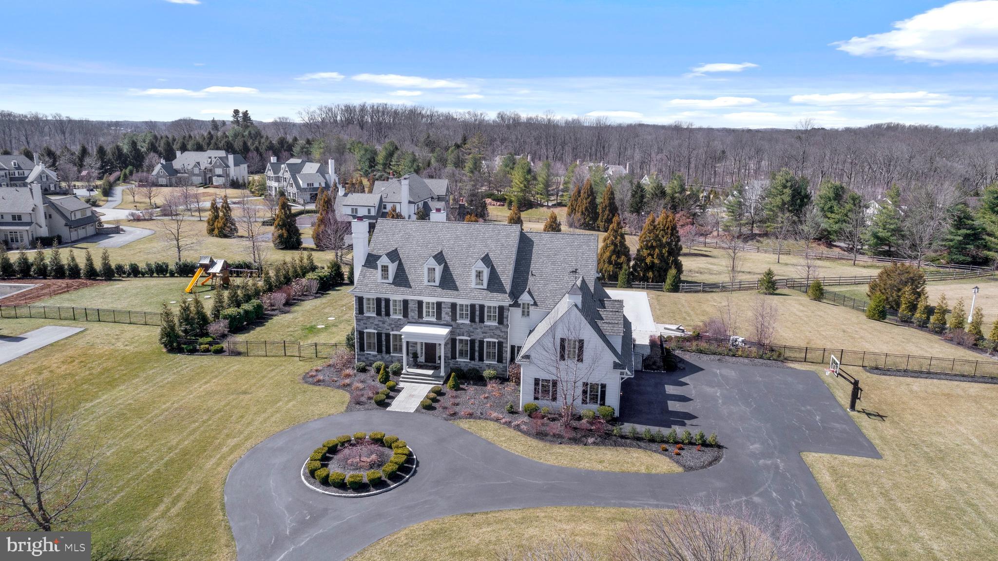 The world is getting ready to entertain again and this property promises to provide endless opportunities both inside and out !! From the moment you pull into the premier neighborhood of White Horse, where luxury and community intersect, this sophisticated stone colonial graciously welcomes you from a circular drive. Built by Nolan Builders 6 years ago, elegance abounds as luxury finishes can be found throughout putting this beauty in a class of its own. Upon opening the front door natural light bounces off the gleaming hardwood floors carrying you throughout the First Floor's circular plan while seamlessly connecting the formal and informal spaces. The elegant Foyer is flanked by "perfectly sized" Living and Dining Rooms which are not just used for entertaining, but enjoyed on a daily basis. The heart of the home is warmed by a fireplace that can be captured from the open Family and Kitchen rooms flooded with southern exposure from expansive windows and views of the backyard oasis. A chefs dream, the flawless gourmet Kitchen features stainless- steel appliances, large island with quartz countertops, and neutral cabinetry which conveniently flows into an expansive Mudroom with charming brick flooring and cubbies. The first Floor is completed by a private Office, and Informal and Formal Powder Rooms. Tucked away from the rest of the Second Floor a stunning Master Suite awaits you at the top of stairs providing a private retreat, with his and hers walk-in closets and luxurious marble Master Bath. Hardwood floors guide you into 2 additional Bedrooms with Jack and Jill Bath, and a 4th en-suite Bedroom with private Bath. The Second Floor is completed by an expansive 5th Bedroom and Bath suite over the 3 car Garage. The square footage of this gem continues up to the Third Floor that is fully finished and provides endless opportunities. You will never need to go to a gym again as the Lower Level is a workout enthusiasts dream with a state of the art Exercise Room and steam shower full Bath and Powder Rooms. There is additional finished space perfect for a Theatre/Play/Family Room, and plenty of storage with stairs that lead up to the Mudroom. The inside amenities are not to be outdone by the property's 1.5 acre backyard paradise featuring a resort style salt water Pool and two tired patio with built in grill, pizza oven, warming oven and granite countertops. This home has it all and is move-in ready while being conveniently located near all major highways, shopping centers and restaurants!!! A true treat to see and even better to own!!. Please note that Delaware County is conducting a real estate tax reassessment, effective January 1, 2021 The tax information reported in the multiple listing service is provided from records which may not have updated and may be incorrect. If you have any questions or concerns about the real estate taxes for this property, you should contact the Delaware County Treasurer's Office or call the Tax Reassessment Hotline at 610-891-5695...