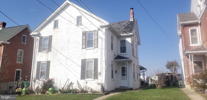 Property is rented thru Antietam Realty on Section 8 for $730.00 per month. Property can be vacant if buyer wishes as lease is on month to month. Hook up for laundry is in kitchen. Washer and Dryer belong to tenant. Range and refrigerator pass with sale.  Seller is getting estimate for a roof replacement.  Off street parking in rear of home. Tenant has been there for 5 years.