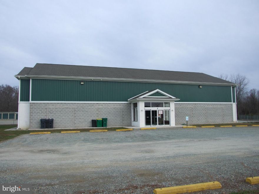 Office building or store front ($5,000) with apartments on the second floor. 3 pole barns. 126 mini-storage units. Fenced storage areas. Along Route 1 Bypass. Close to PA/MD line.