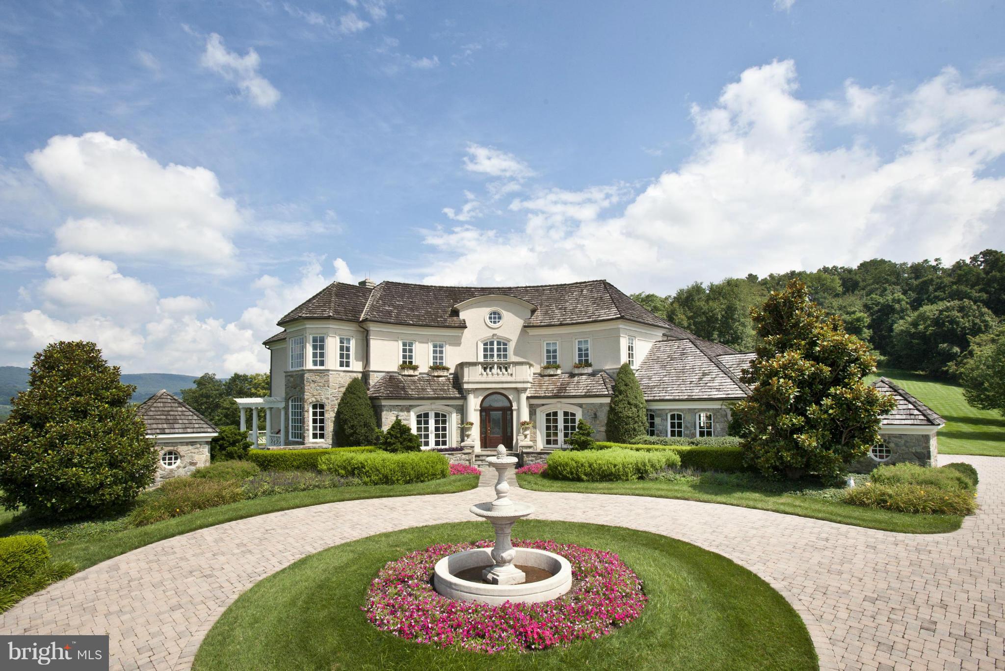 WOW! Gorgeous custom estate on 41+ lush acres with stunning panoramic mountain & meadow vistas! Pool, spa, gazebo, add l buildable lot for family member! Beautiful 7BR, 5 Full, 2 half BA home, quality construction, top features, garages for 5 cars! Equally convenient to Washington, D.C. & Baltimore (about 60mi.), excellent schools, 3 championship golf courses nearby. LIVE THE DREAM--MUST SEE!